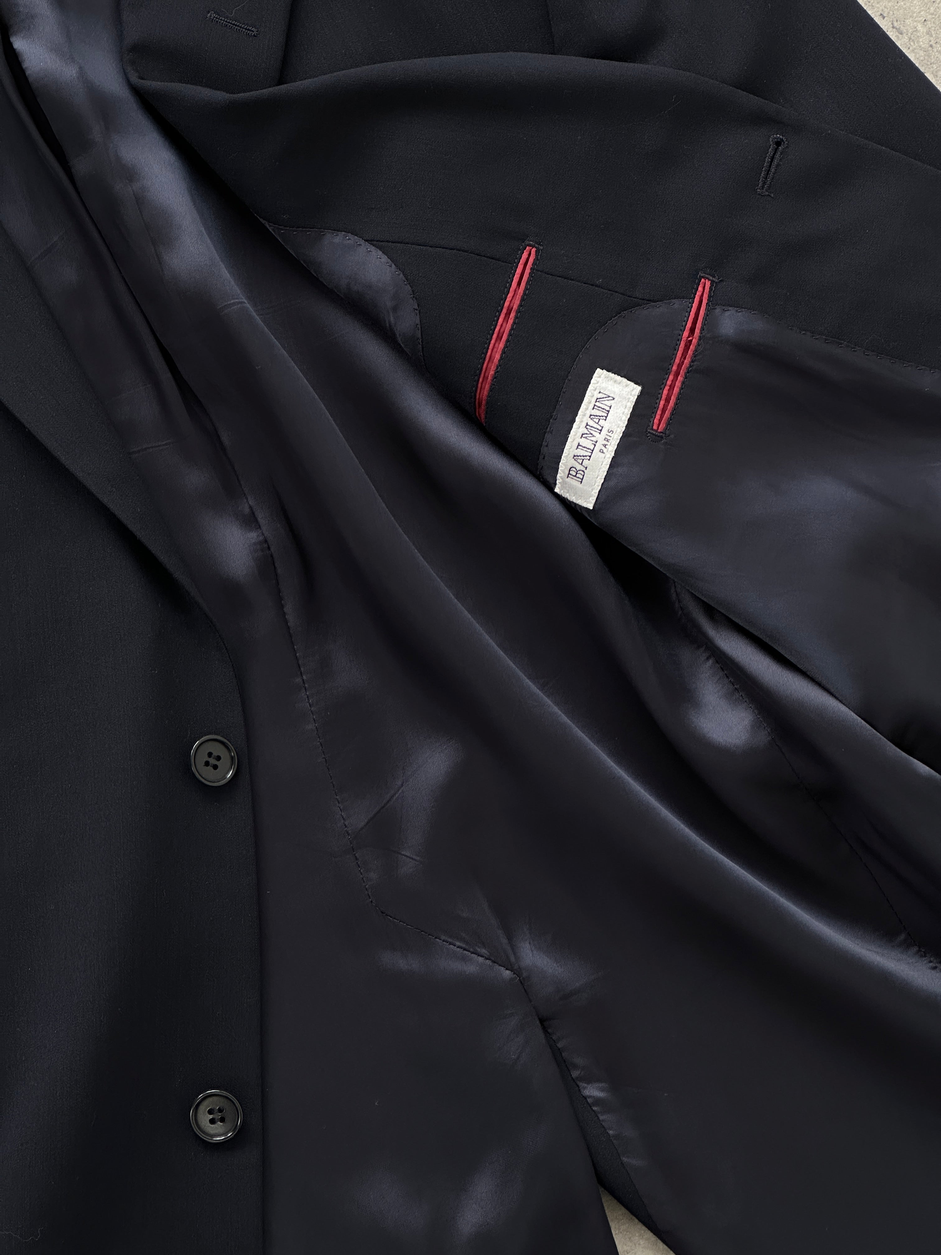 Balmain Paris single-breasted wool blazer in size 44R/L, tailored fit with classic lapel, dark color, and structured design.