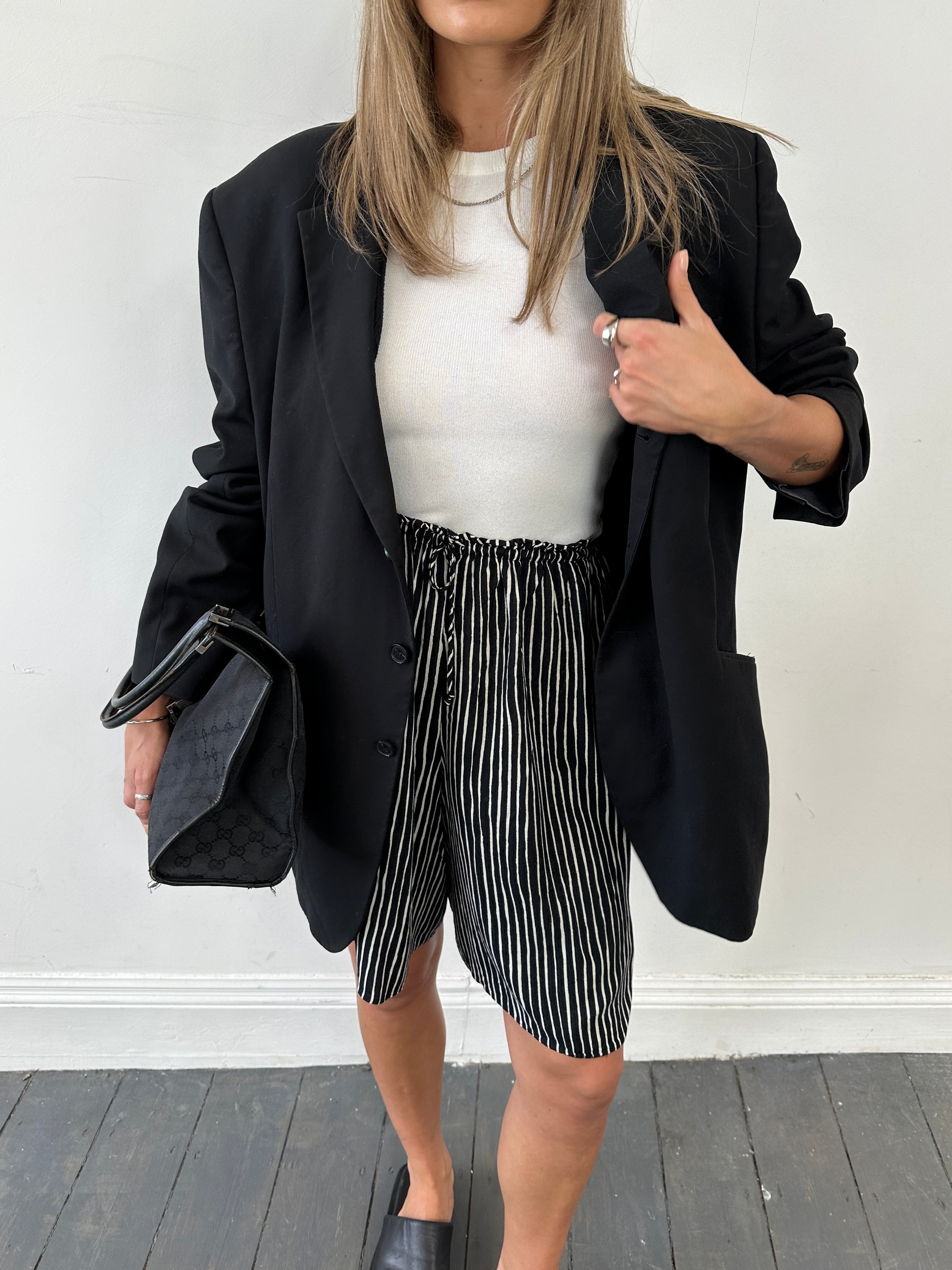 St Michael drawstring wide-leg striped shorts in blue and white, shown on a model with a casual summer look.
