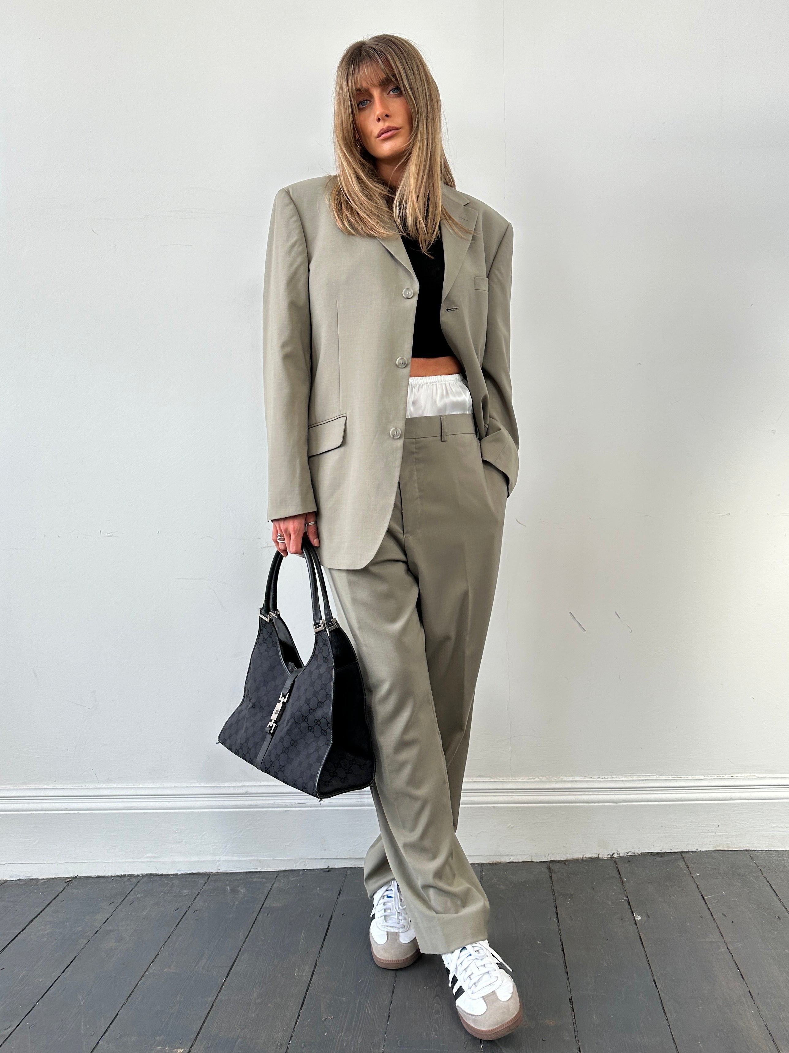 Vintage wool single-breasted suit jumpsuit in size 44R/W34, featuring classic tailored design and vintage styling.