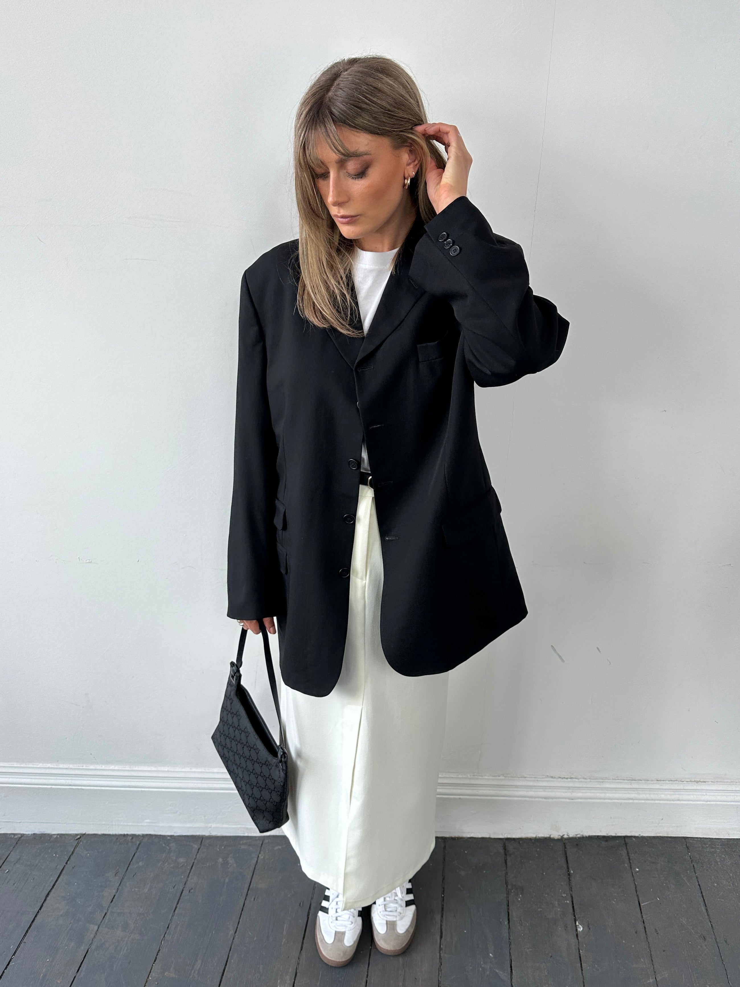 Vintage pure wool tailored single-breasted blazer in size 46/XL, shown on a hanger with classic lapel and structured fit.