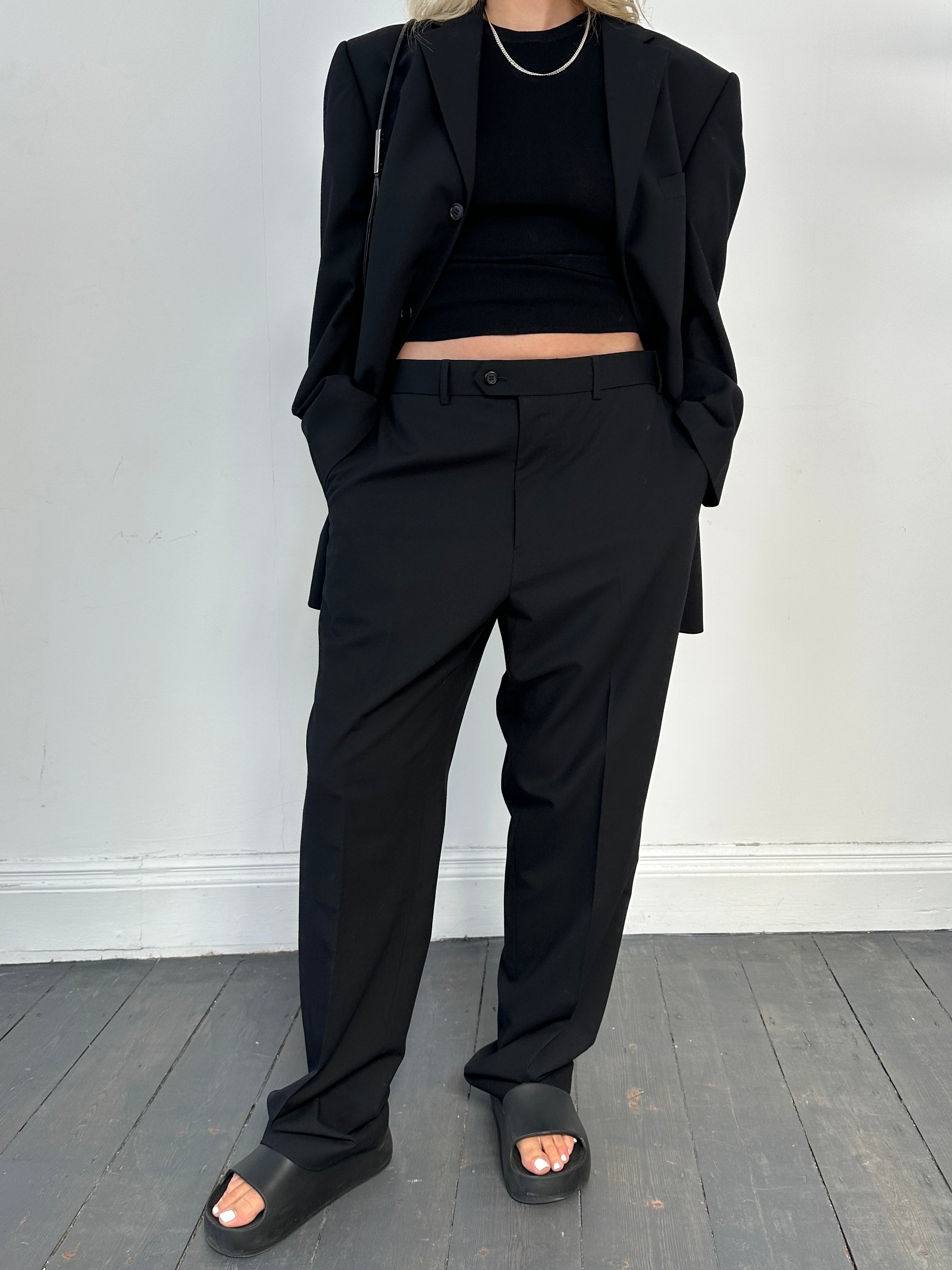 Vintage single-breasted wool blend jumpsuit in size 42R/W36, featuring tailored lapels and a classic suit silhouette.