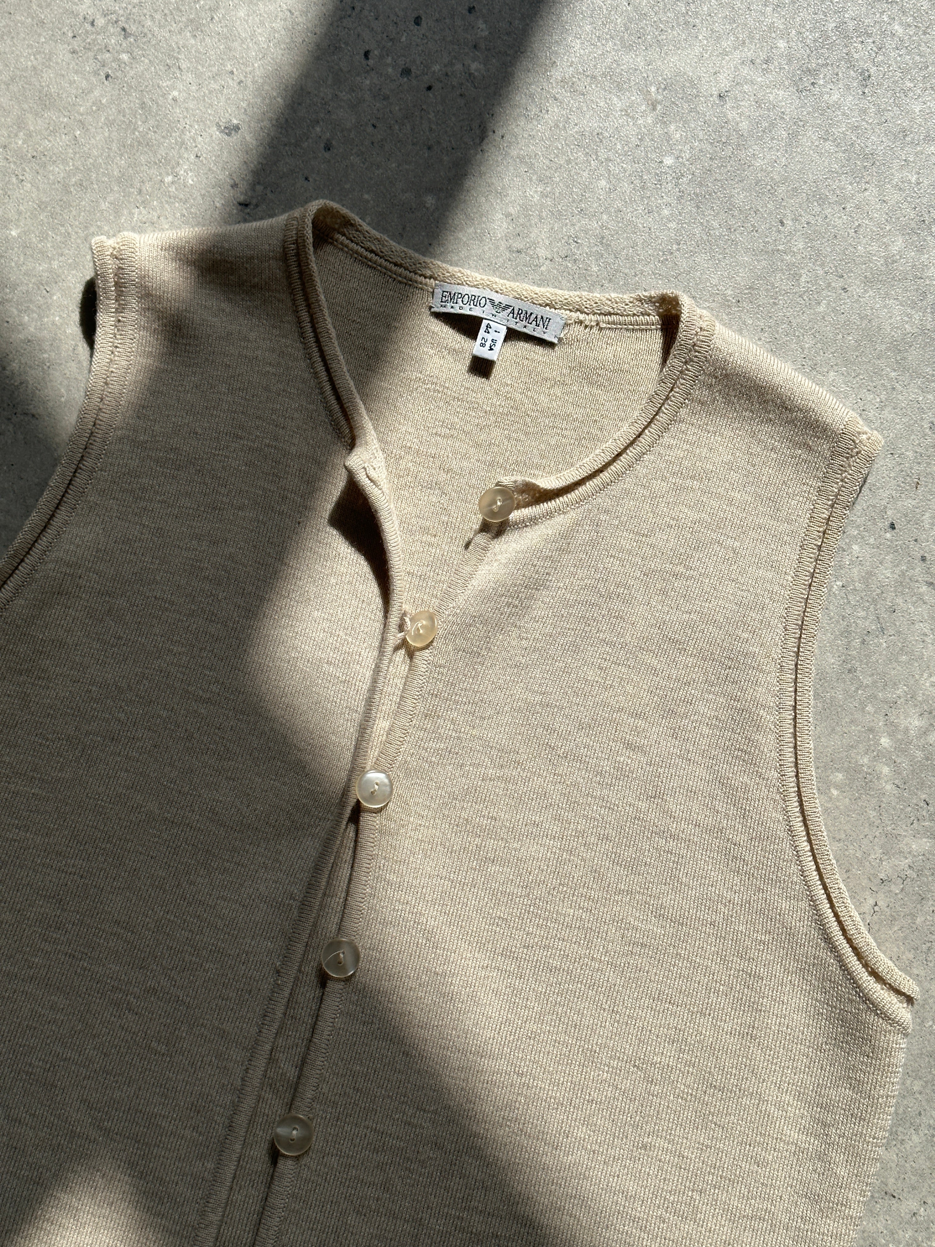 Emporio Armani pure wool knit waistcoat in S/M, featuring a tailored coat design with a classic collar and button closure.