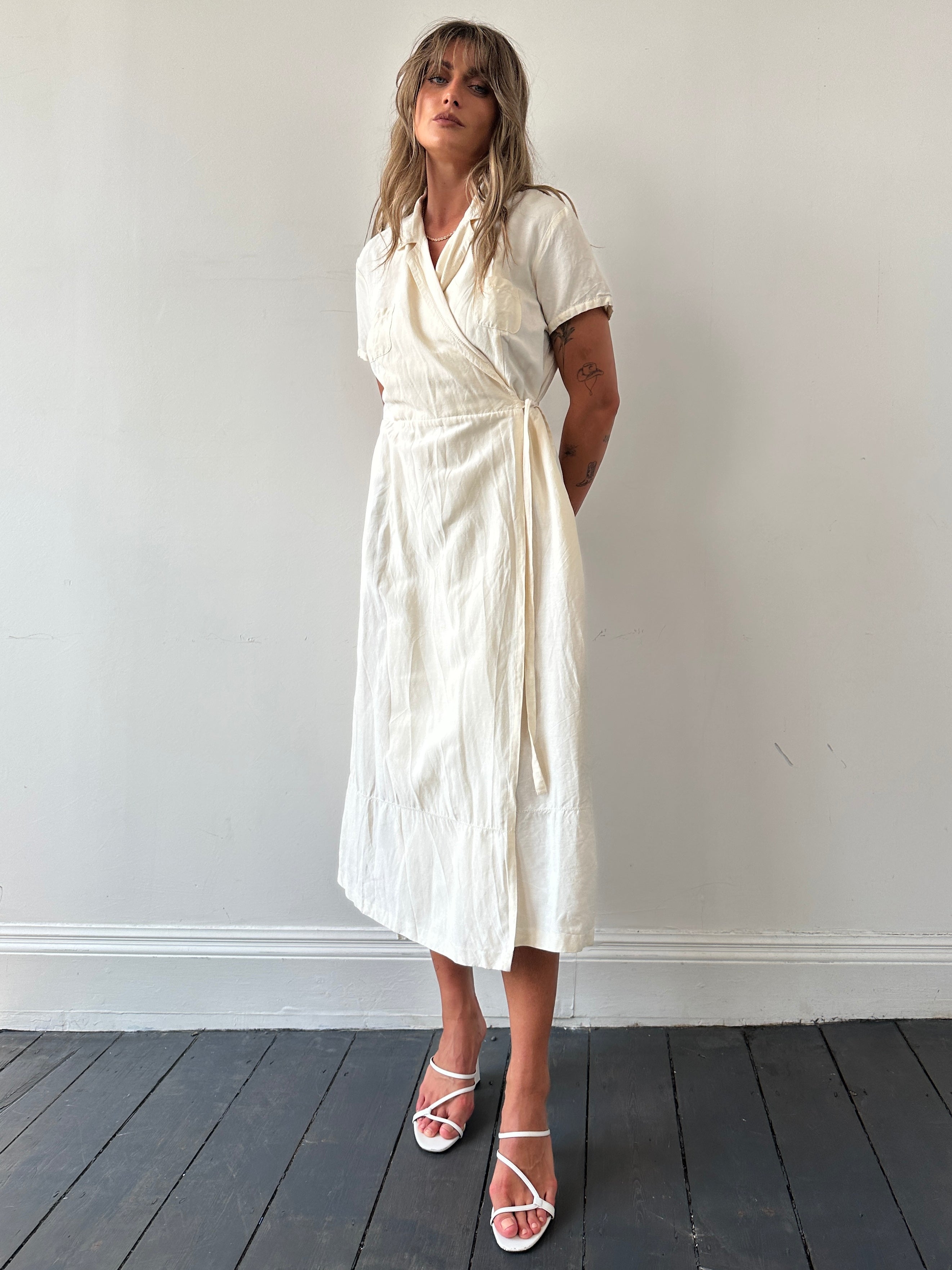 Laura Ashley silk linen maxi wrap dress in S/M, featuring a flowing design with long sleeves and a stylish wrap front.