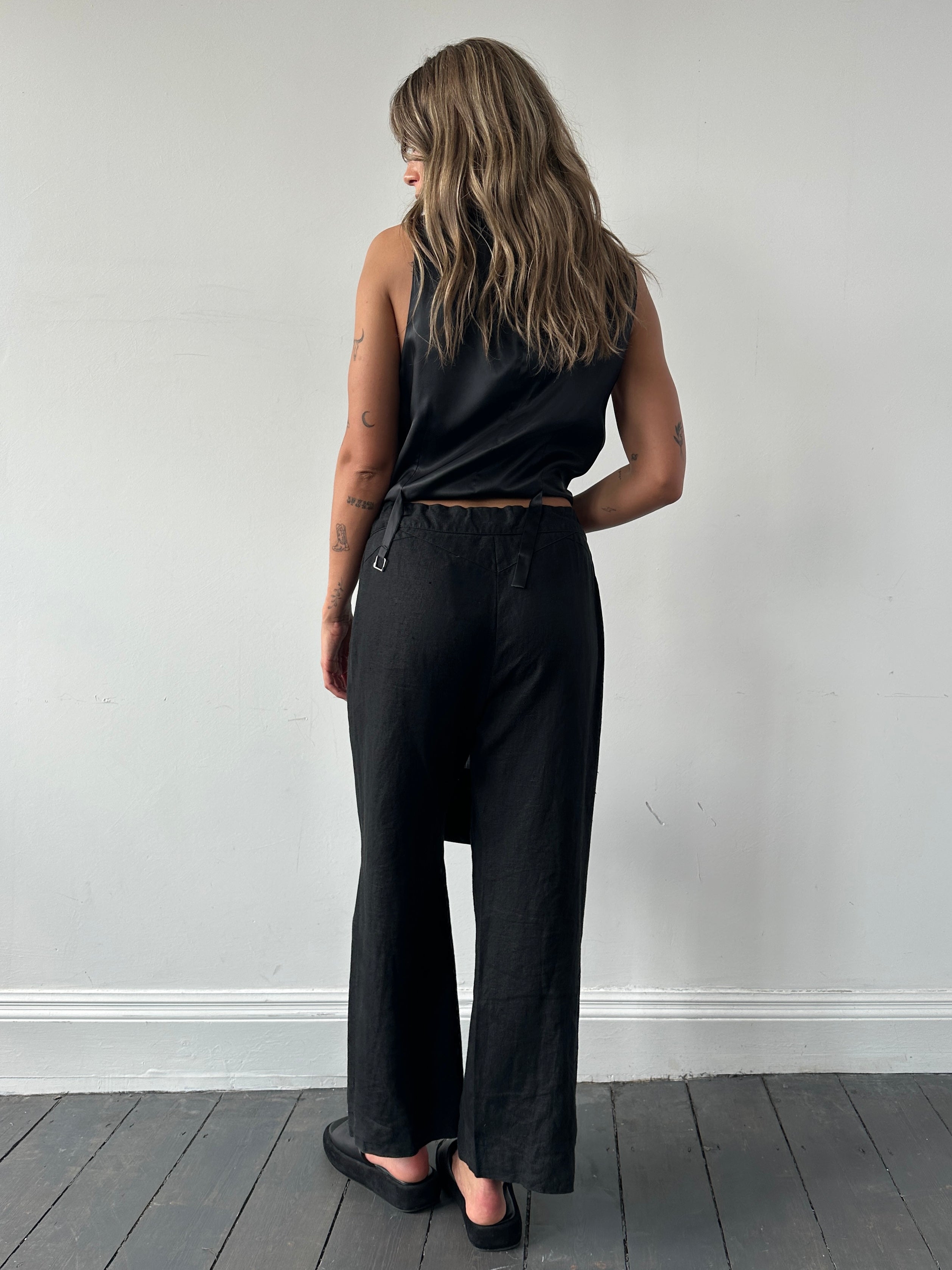 Light beige Jaeger linen wide leg trousers with elastic waistband and relaxed fit, displayed on a neutral background.