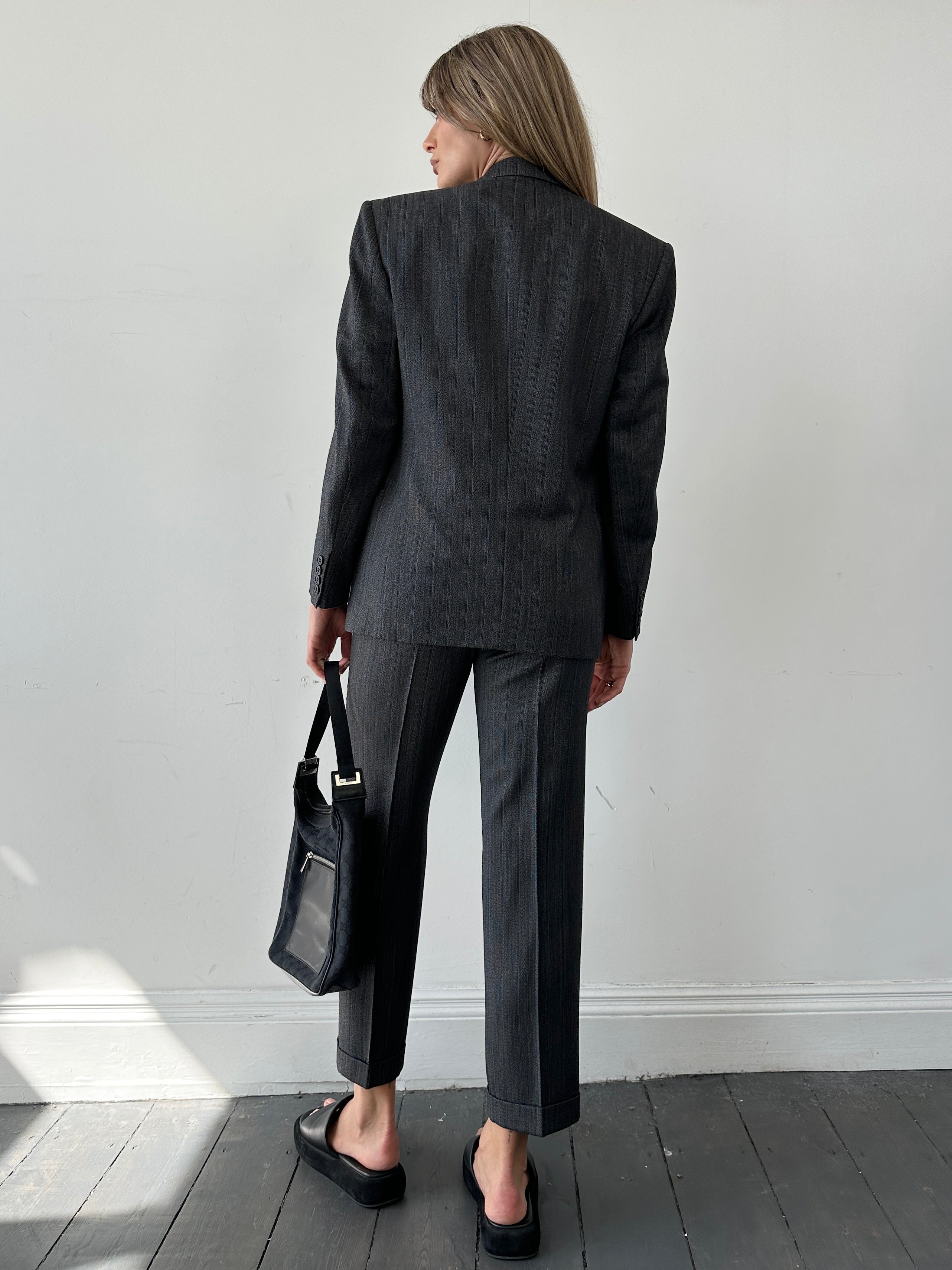 Christian Dior silk wool pinstripe single-breasted jumpsuit in size 36S/W28, featuring tailored design and classic pinstripe pattern.