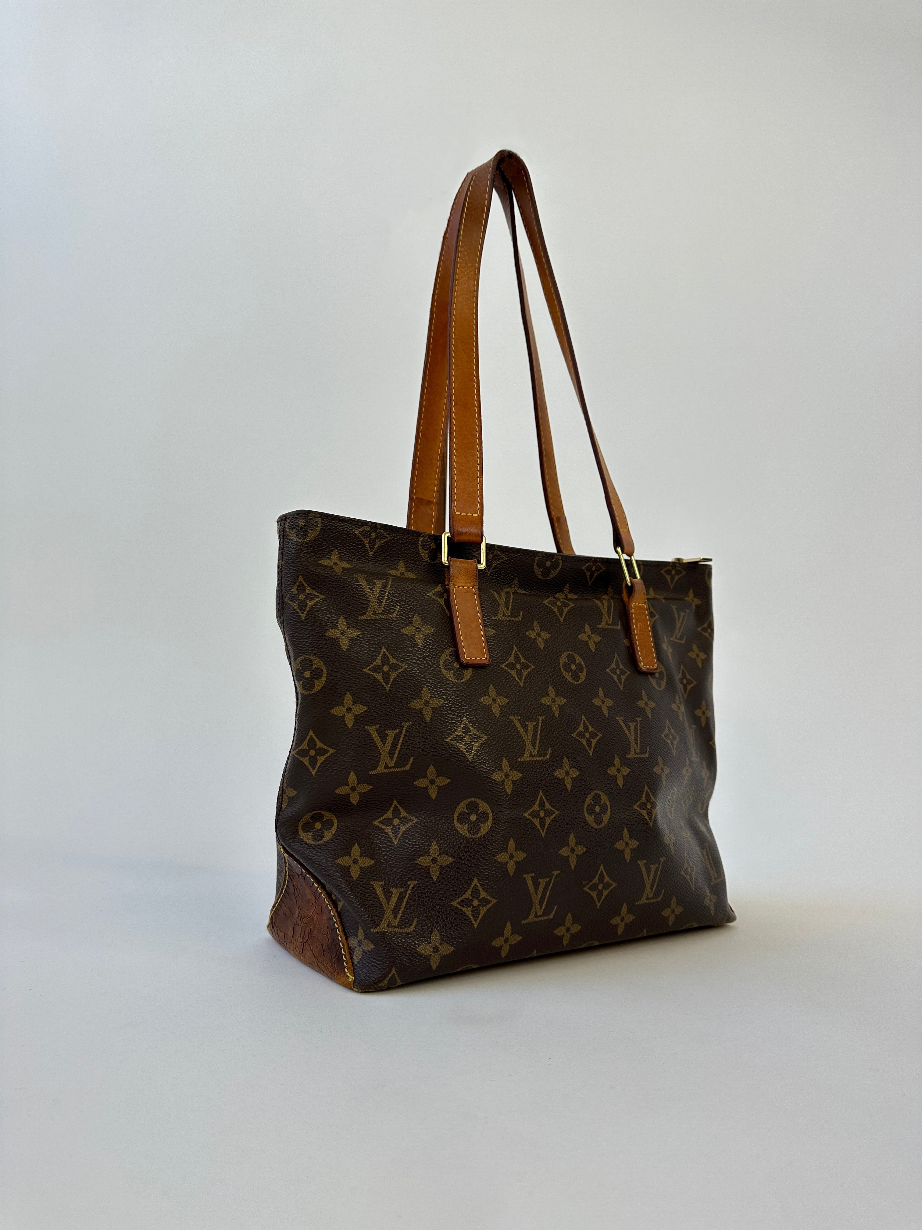 Louis Vuitton 2002 Cabas Mezzo Monogram shoulder bag with leather trim and adjustable strap, featuring iconic LV monogram pattern.