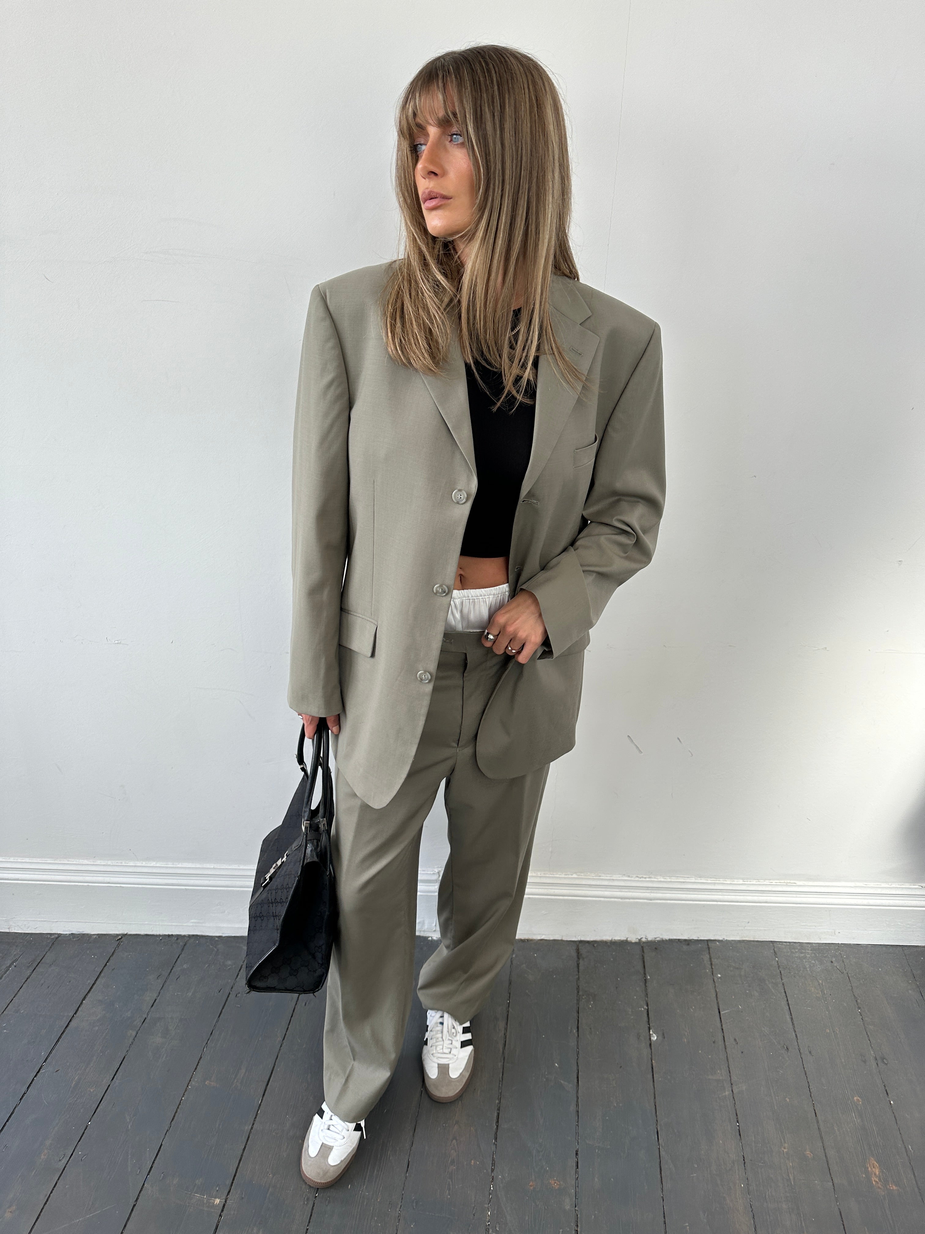 Vintage wool single-breasted suit jumpsuit in size 44R/W34, featuring classic tailored design and vintage fabric details.