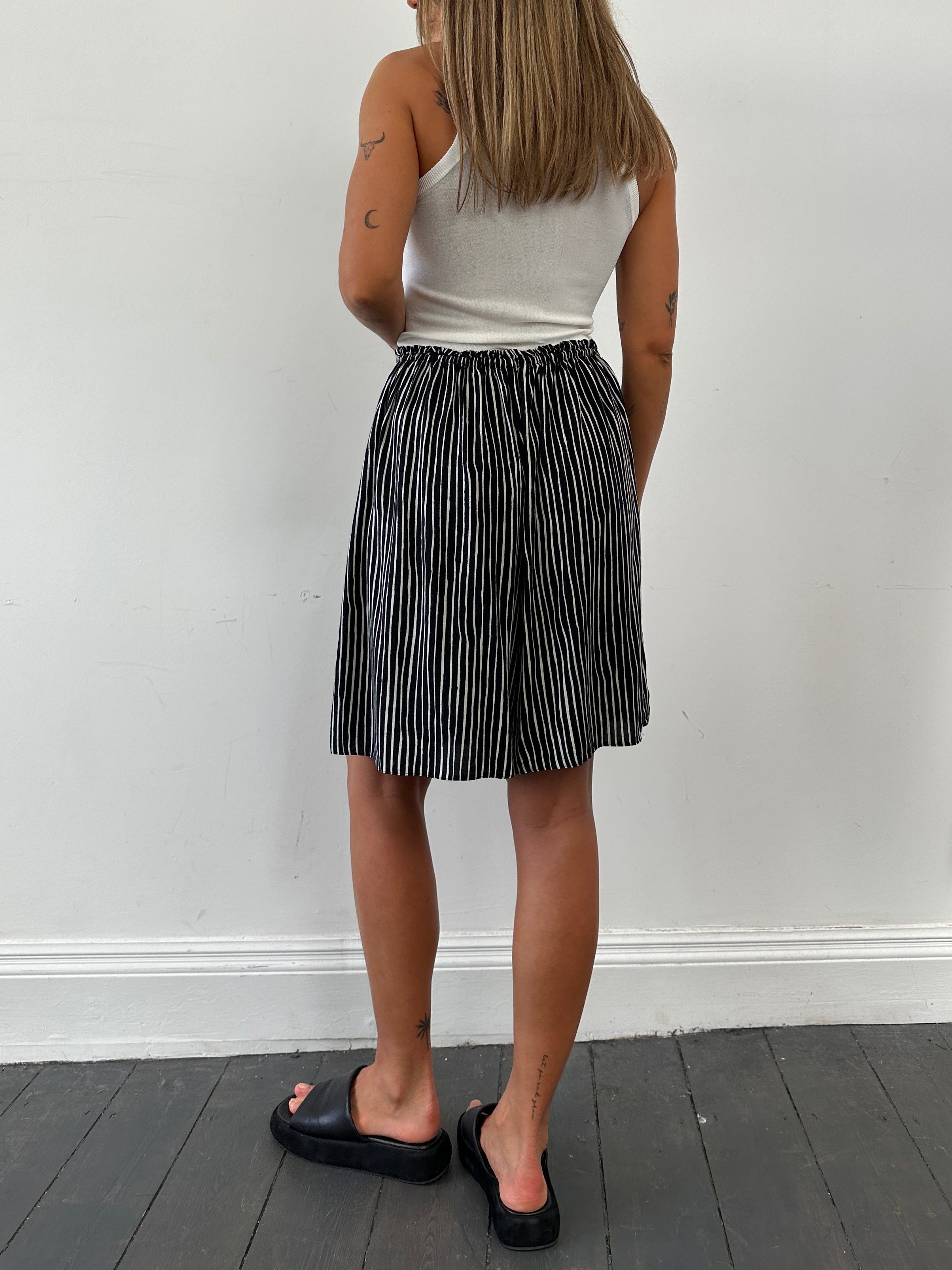 St Michael men's drawstring wide leg striped shorts in black and white, featuring a relaxed fit and casual style.