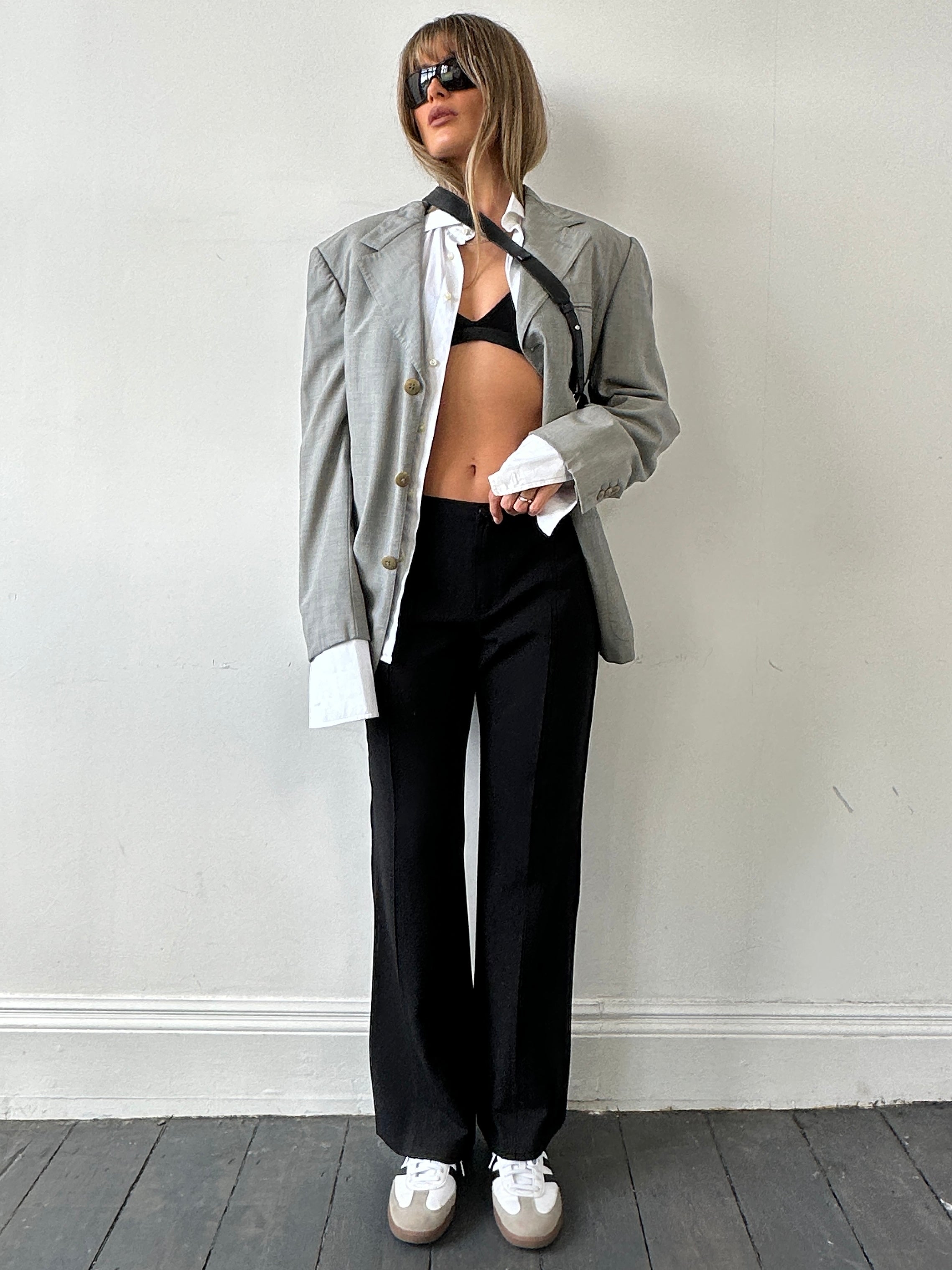 Moschino jeans virgin wool low waist flared trousers in size W34 UK 12, showcasing the stylish fit and fabric details.