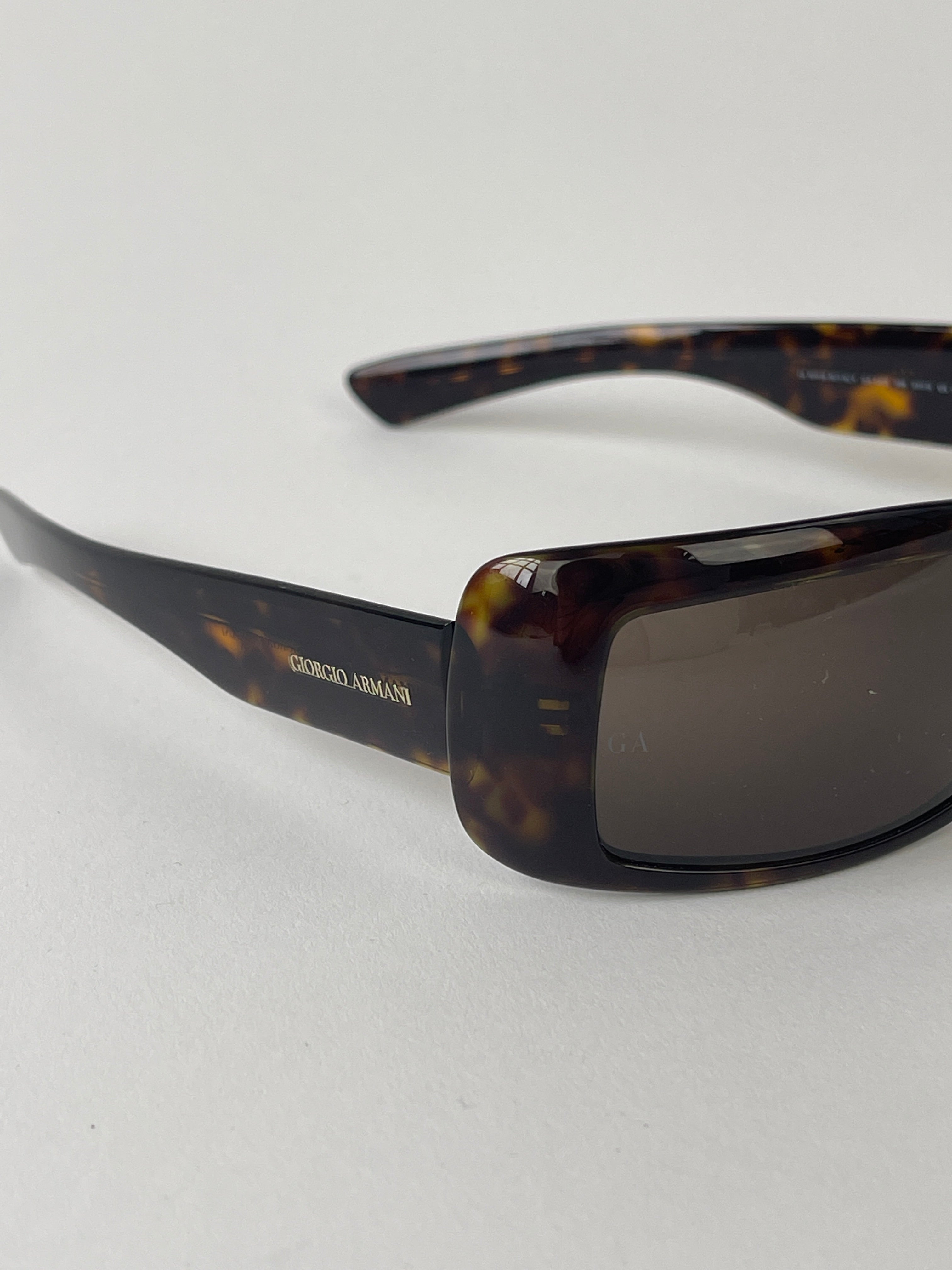 Giorgio Armani rectangle tortoise shell sunglasses with dark tinted lenses and sturdy frame, stylish and sophisticated eyewear.