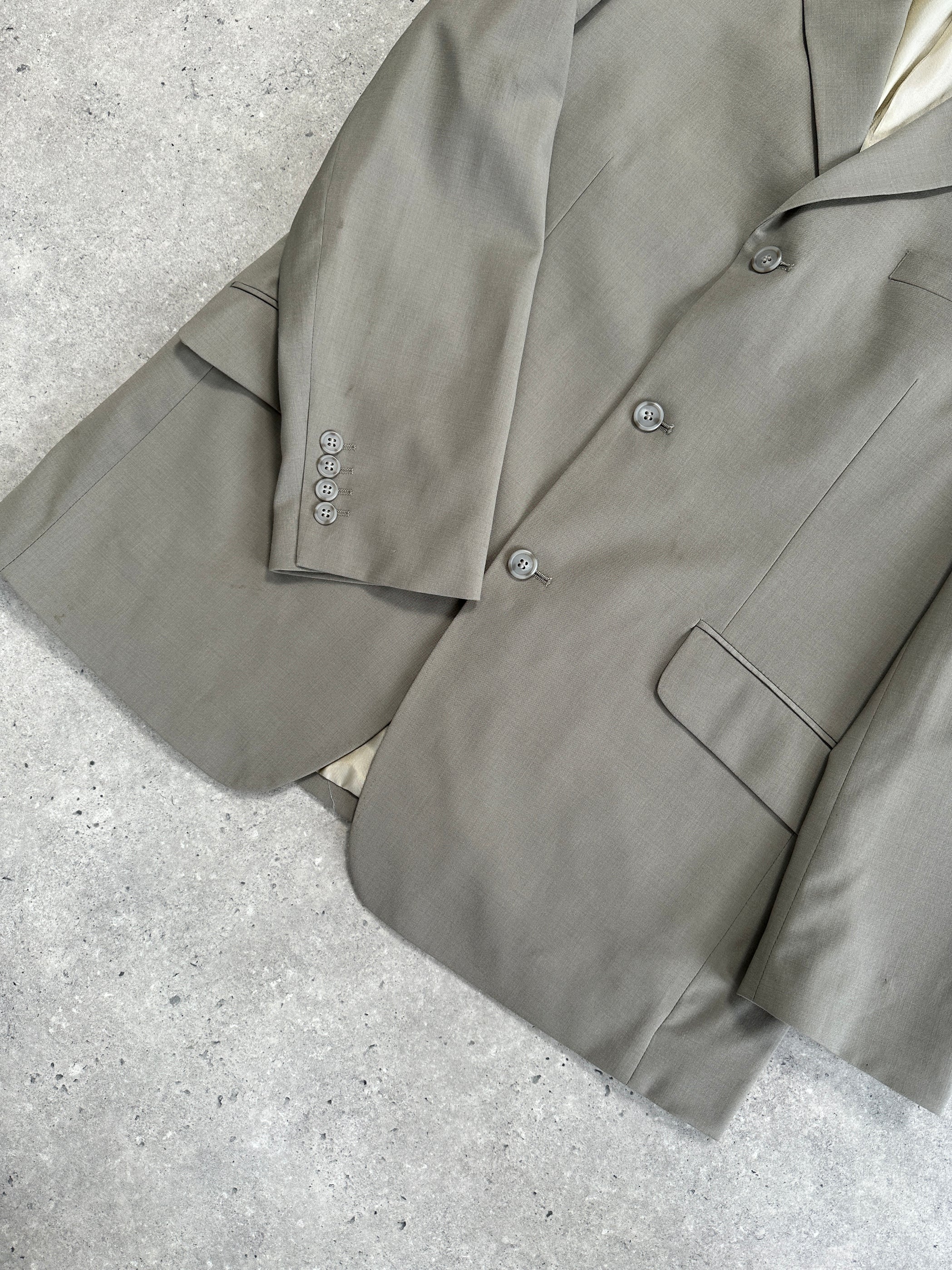 Vintage wool single-breasted jumpsuit in size 44R/W34, featuring a classic tailored fit and vintage-inspired style.