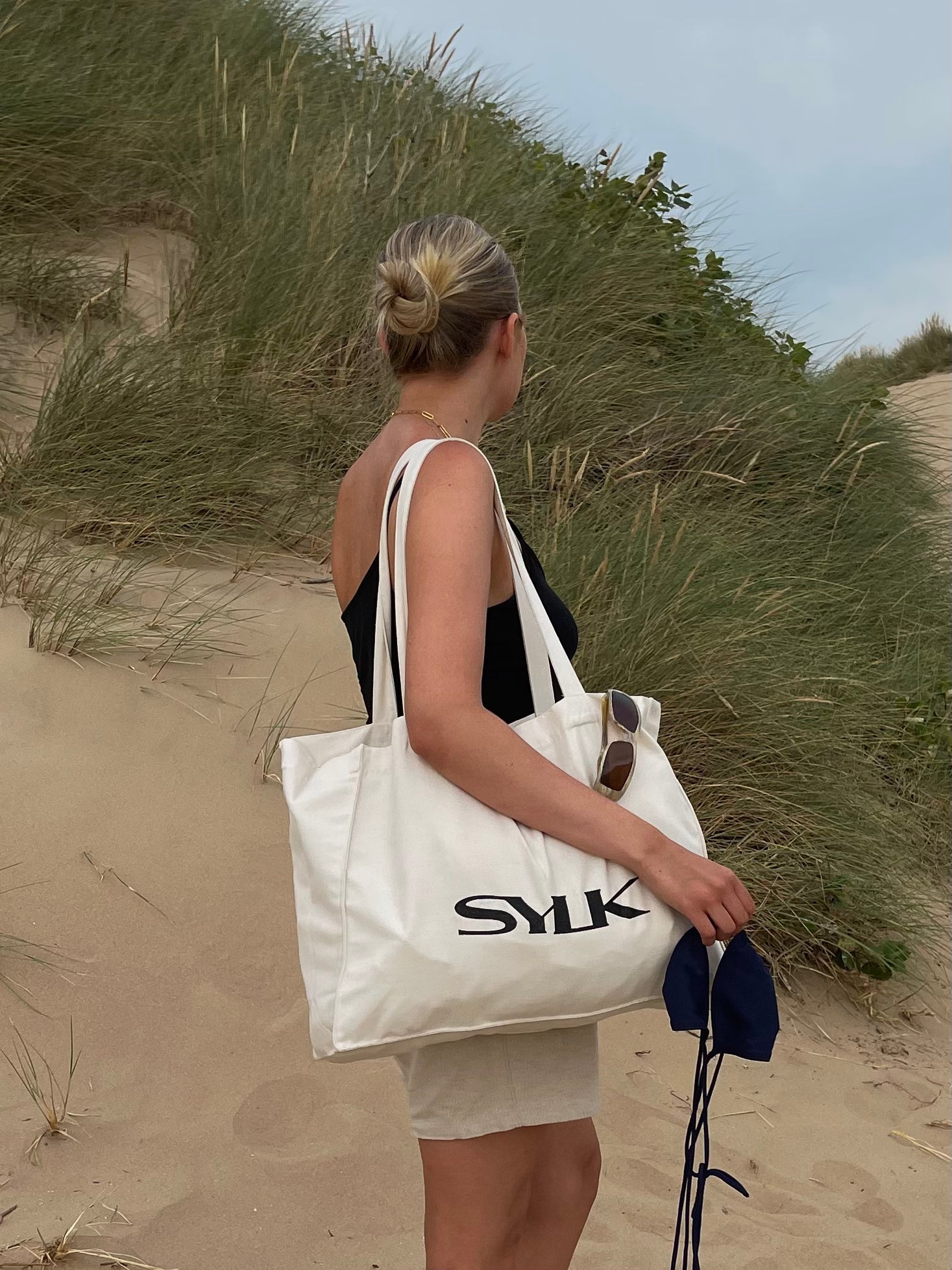 SYLK recycled cotton tote bag with eco-friendly design and sturdy handles, ideal for shopping or everyday use.