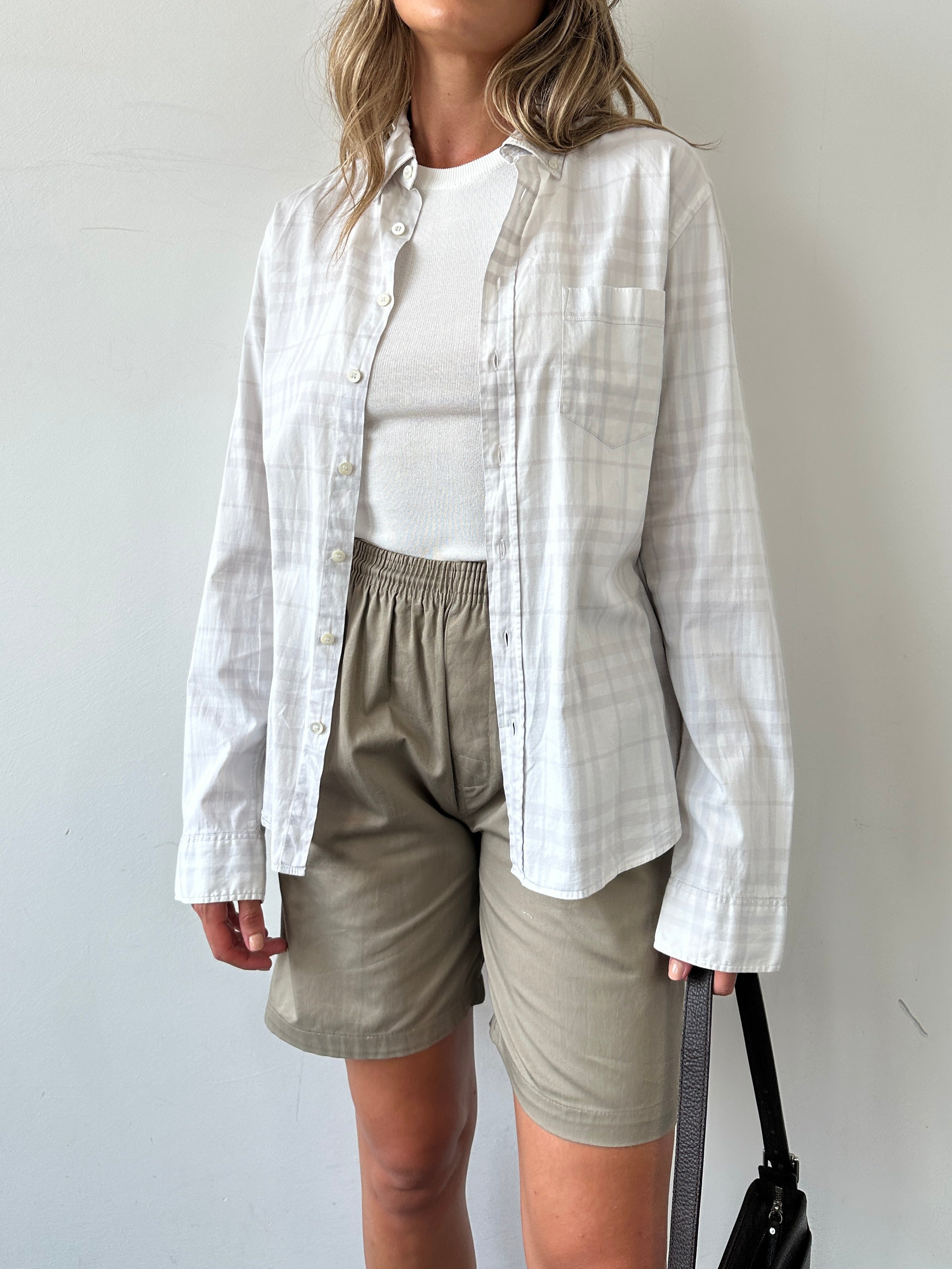 Burberry London Check cotton shirt in size S/M, featuring the classic beige, black, and red check pattern and button-down front.