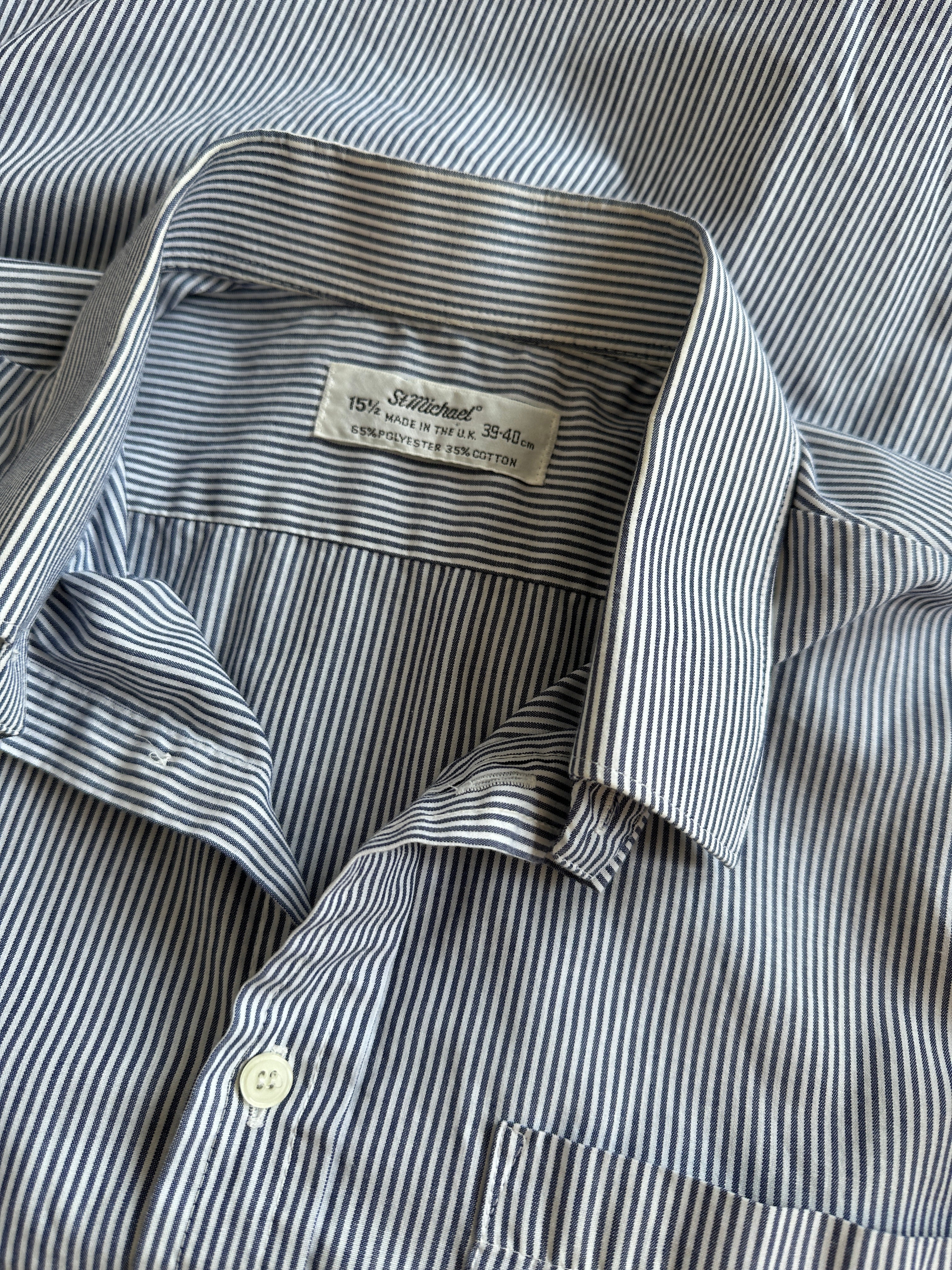 St Michael pinstripe shirt in size M/L, featuring a classic button-down design with vertical pinstripes and a collar.