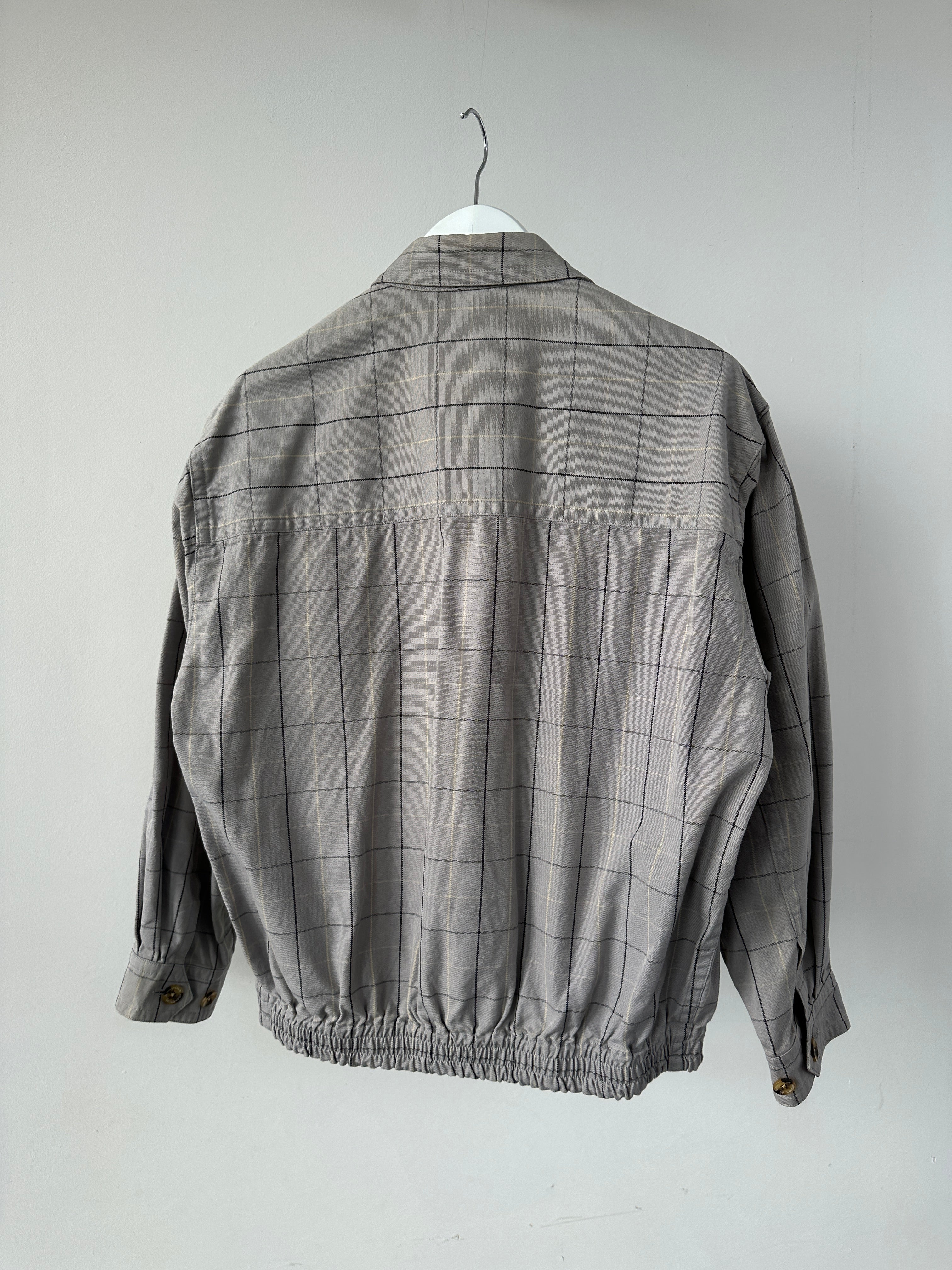 Aquascutum check cotton bomber jacket in size S, featuring classic plaid pattern and casual fit, displayed on a hanger.