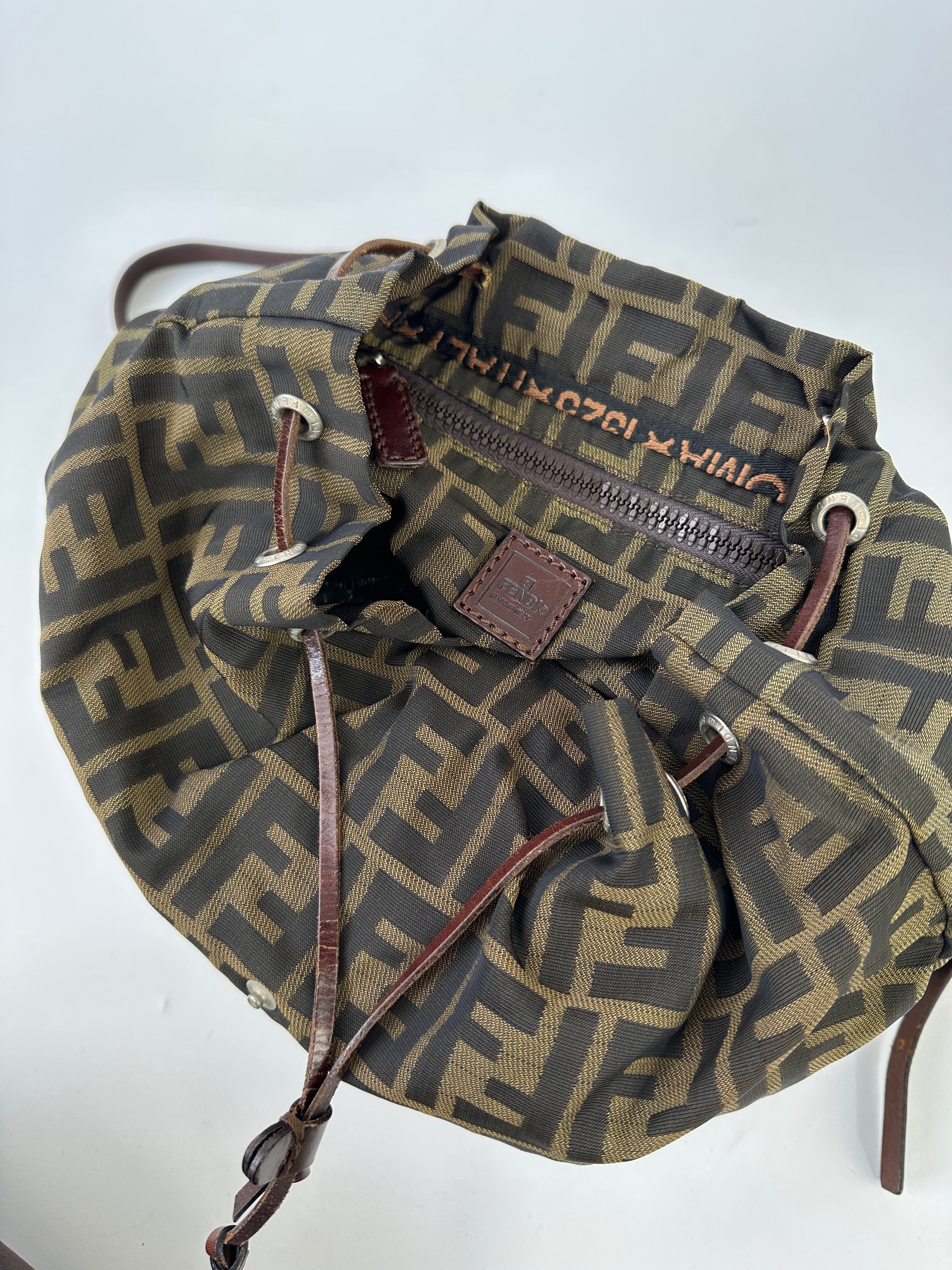 Fendi Zucca FF monogram rucksack bag with adjustable straps and leather accents, showcasing classic designer style.