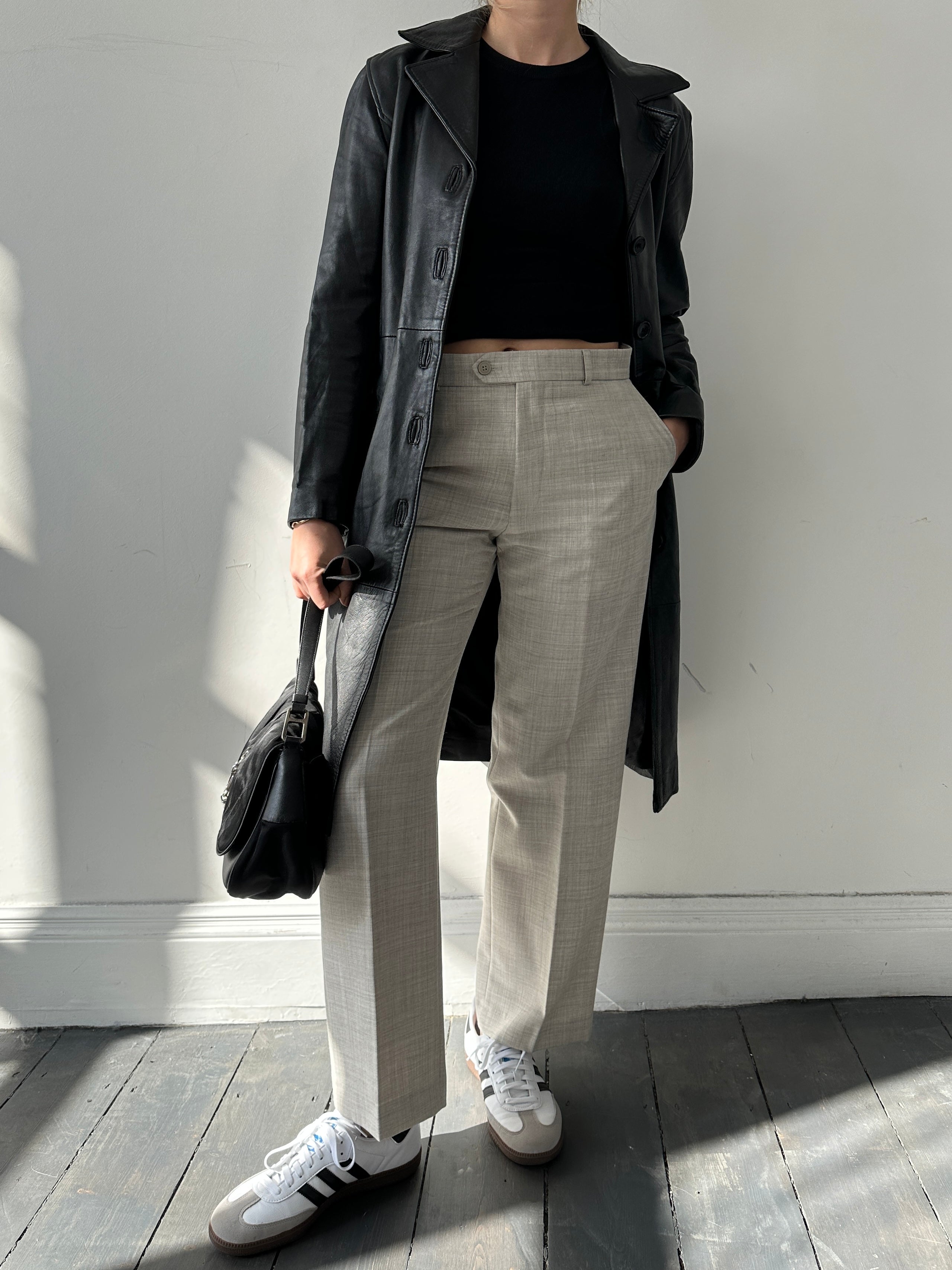 Italian vintage leather jacket in XS, featuring classic design and aged leather texture, displayed on a neutral background.