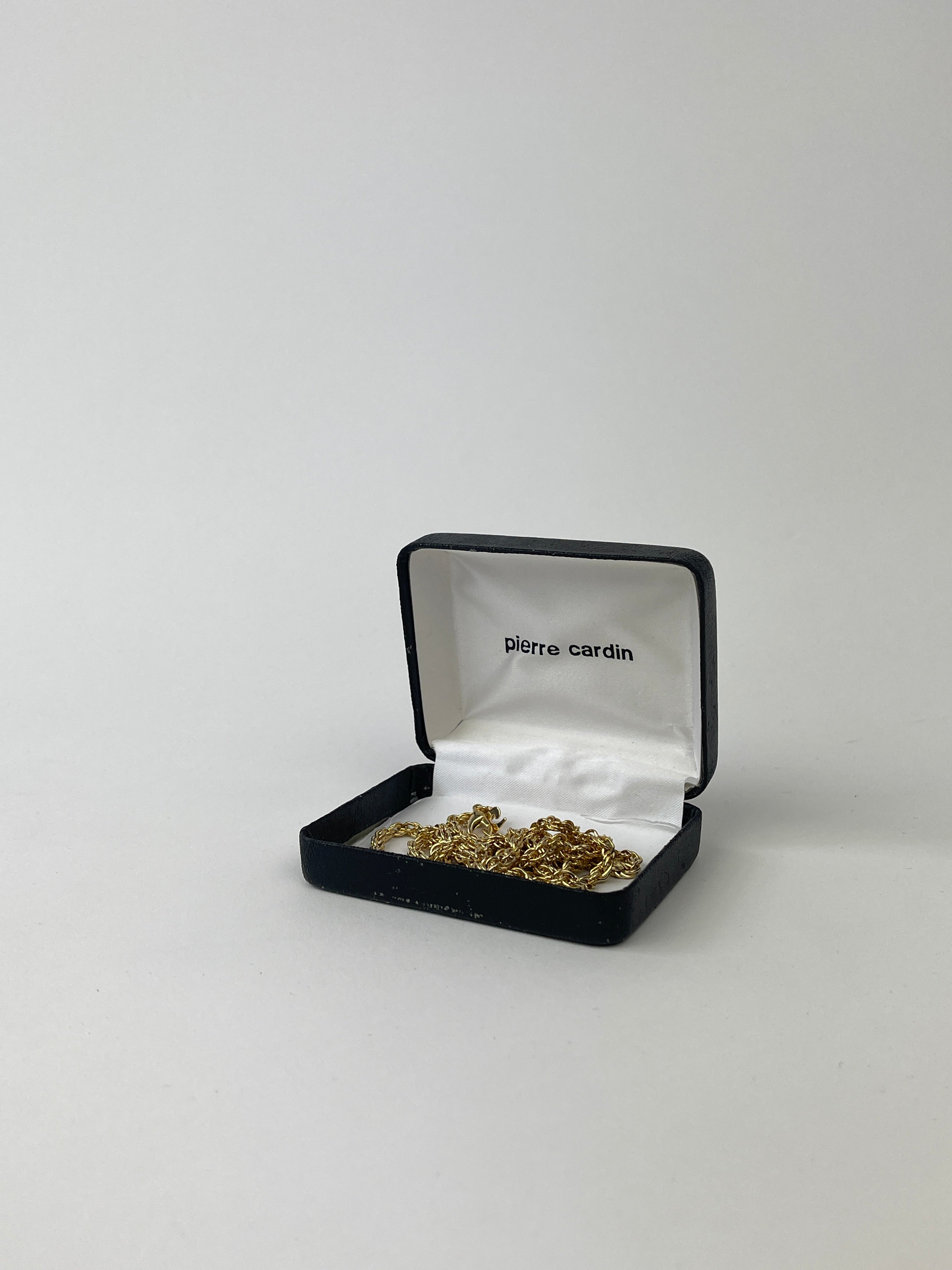 Pierre Cardin gold plated necklace and bracelet chain set with linked design and polished finish, displayed on a neutral background.