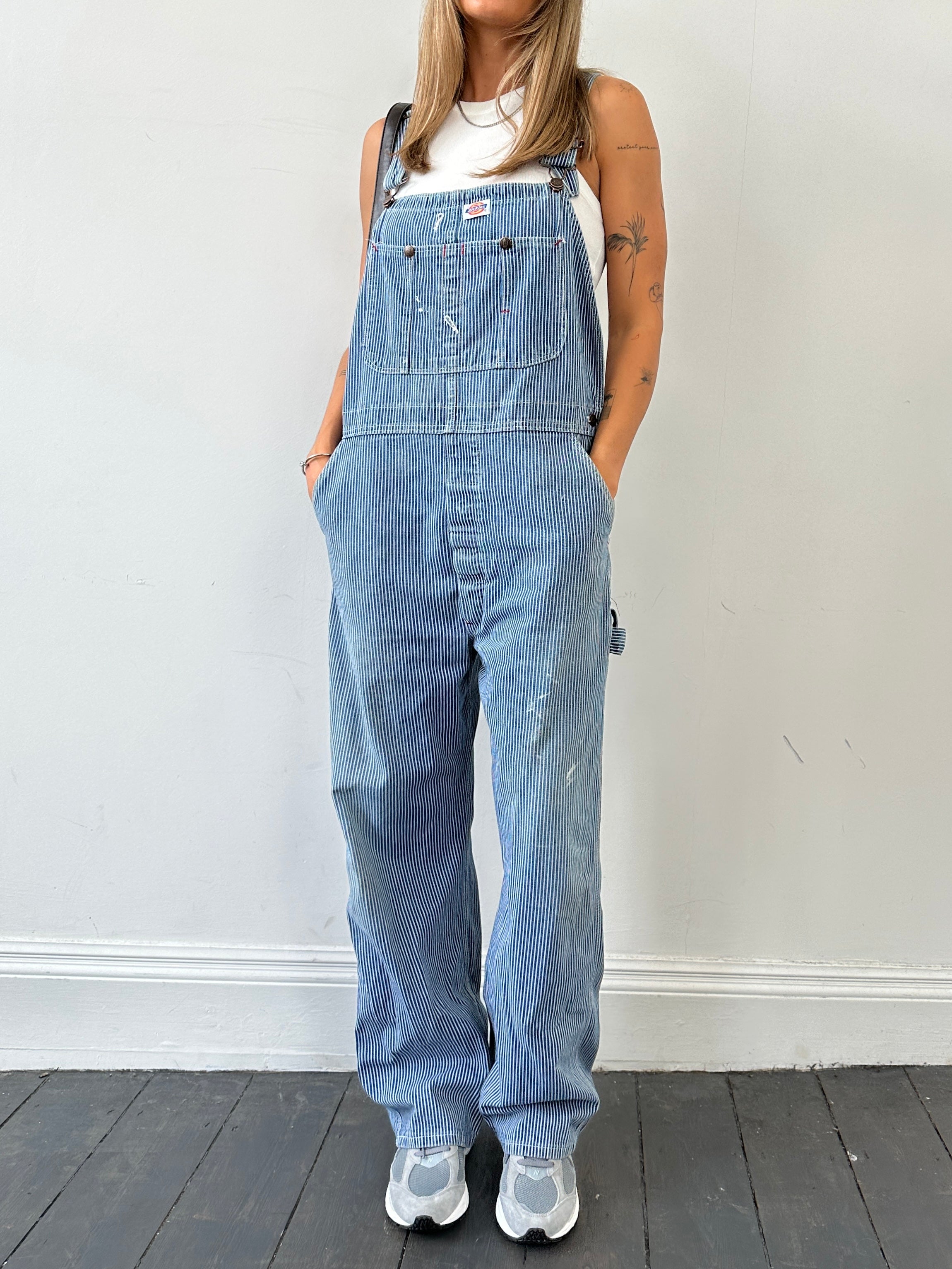 Dickies pinstripe pure cotton dungarees in size M/L, showing the front view with adjustable shoulder straps and classic pocket details.