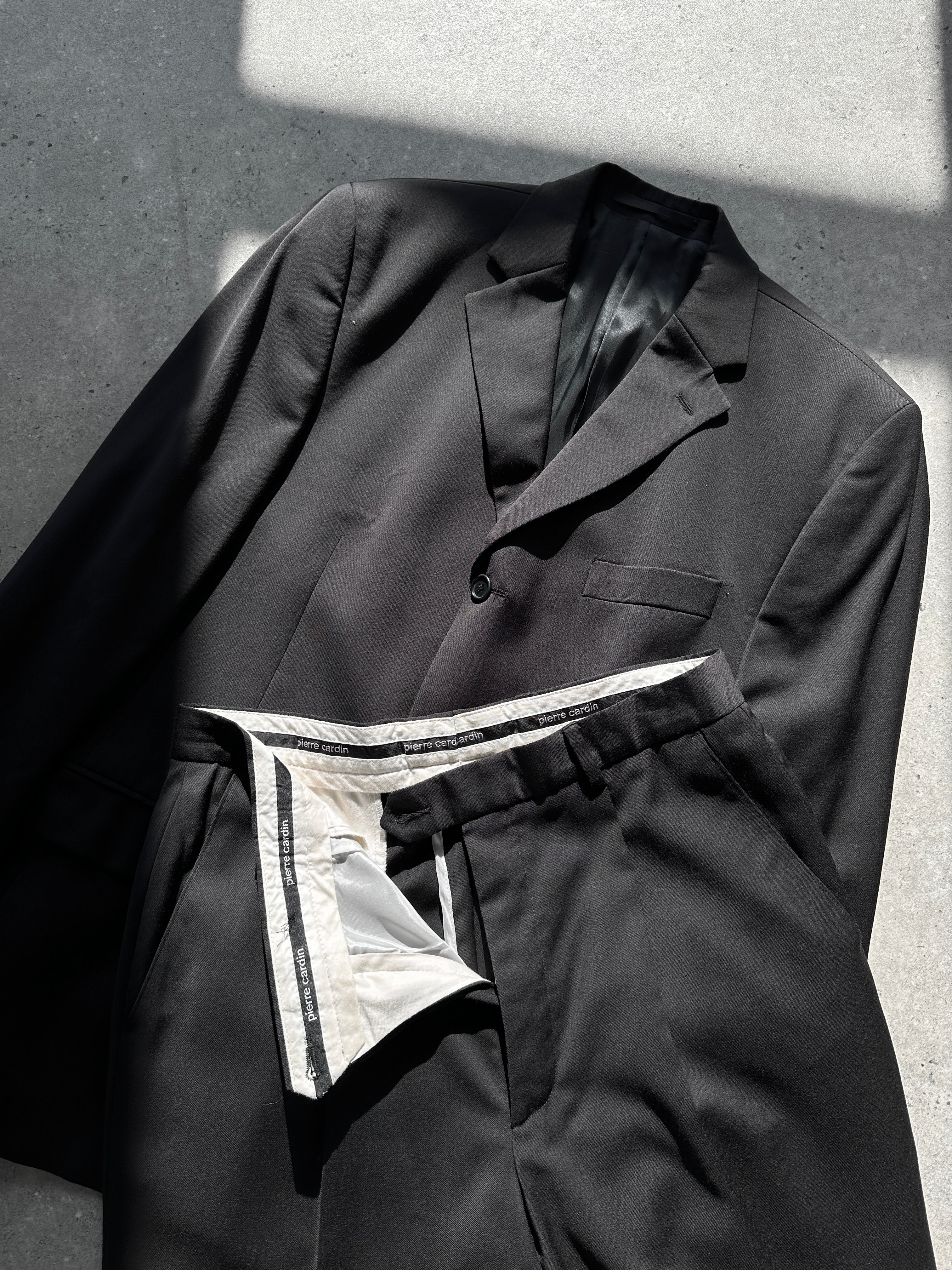 Pierre Cardin pure wool single-breasted jumpsuit in size 40R/W34, tailored fit with classic lapel and button closure.