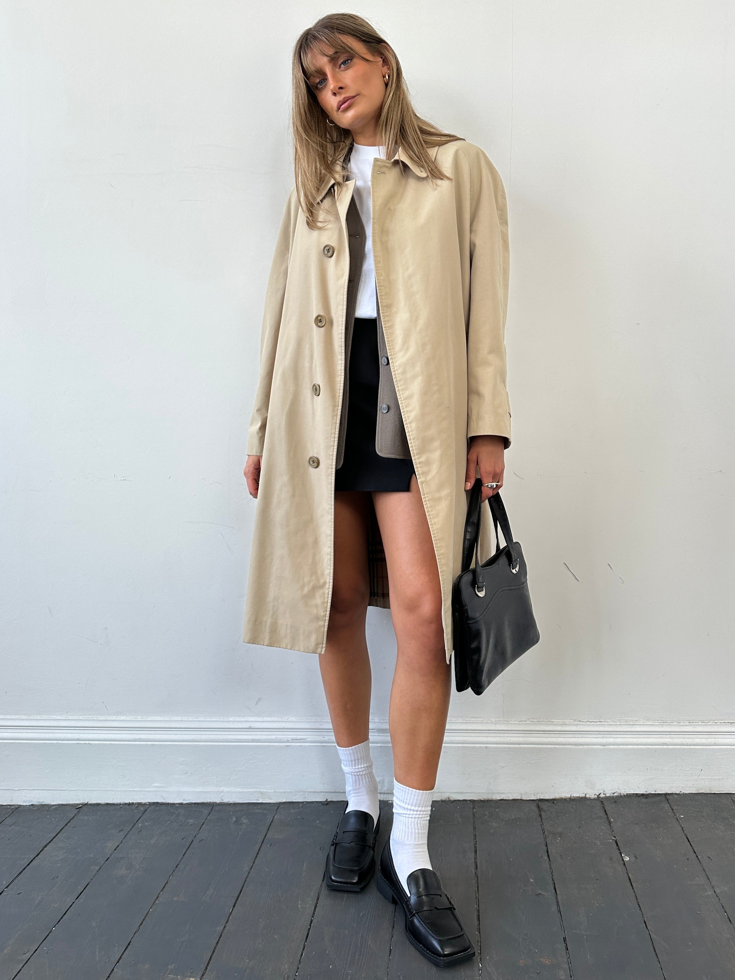 Burberry Nova Check trench coat in large size, featuring classic check pattern and tailored design, displayed on a hanger.