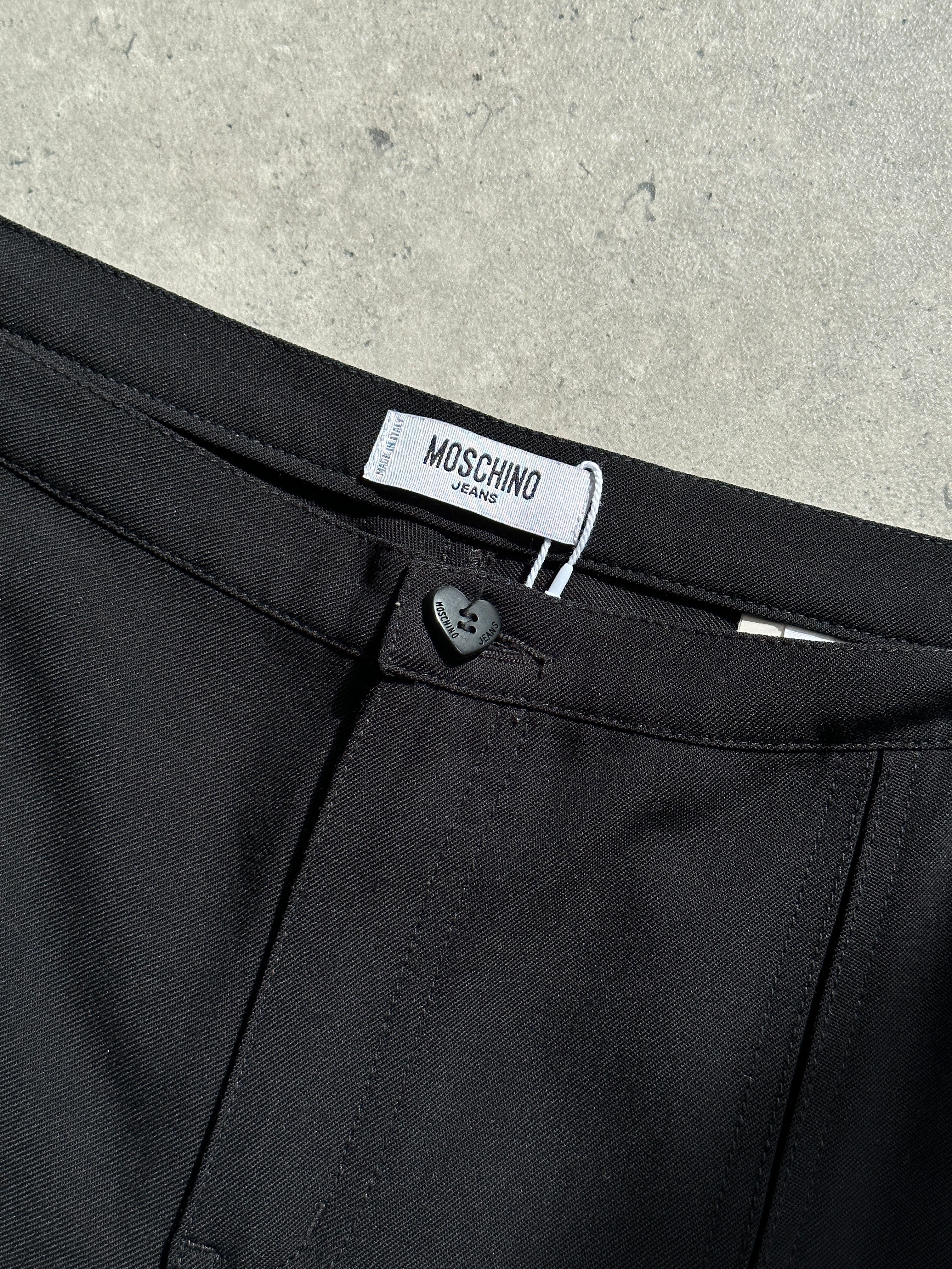 Moschino virgin wool low waist flared trousers in size W34 UK 12, shown on model with front view and classic fit.