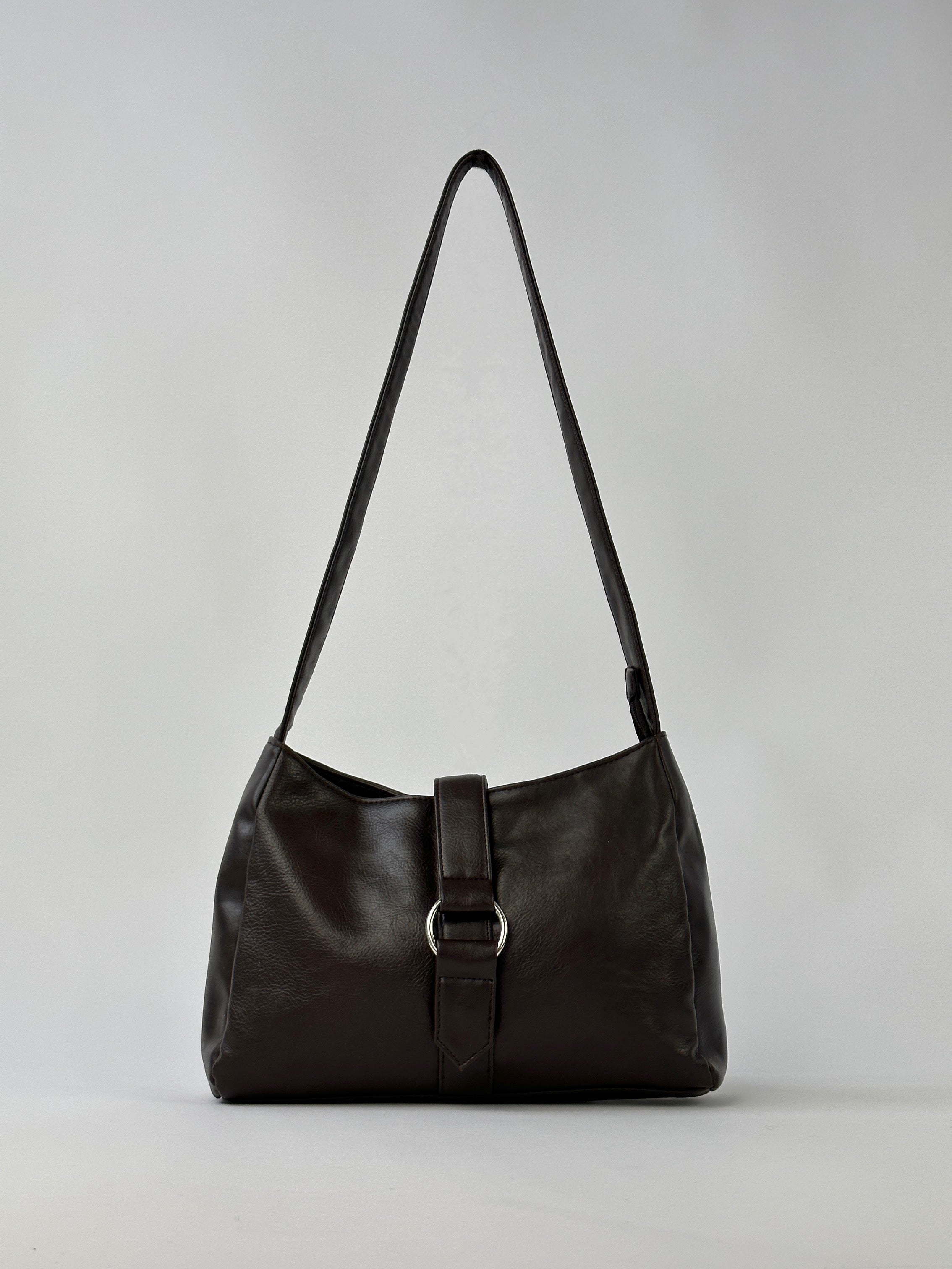 Vintage 2000s faux leather shoulder bag with a classic design, featuring a structured shape and adjustable strap.