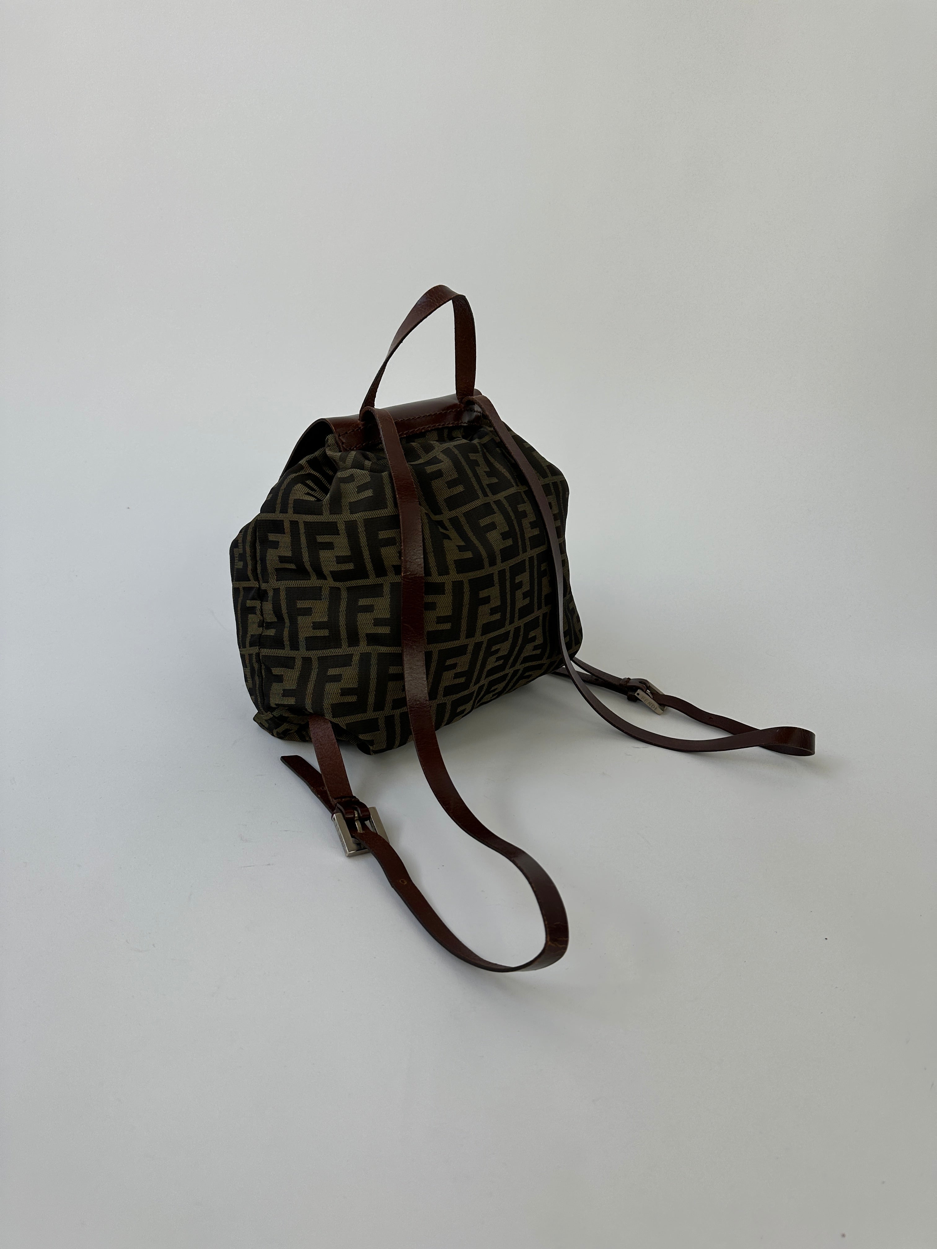 Fendi Zucca FF Monogram Rucksack bag with adjustable straps and signature brown and beige monogram pattern.