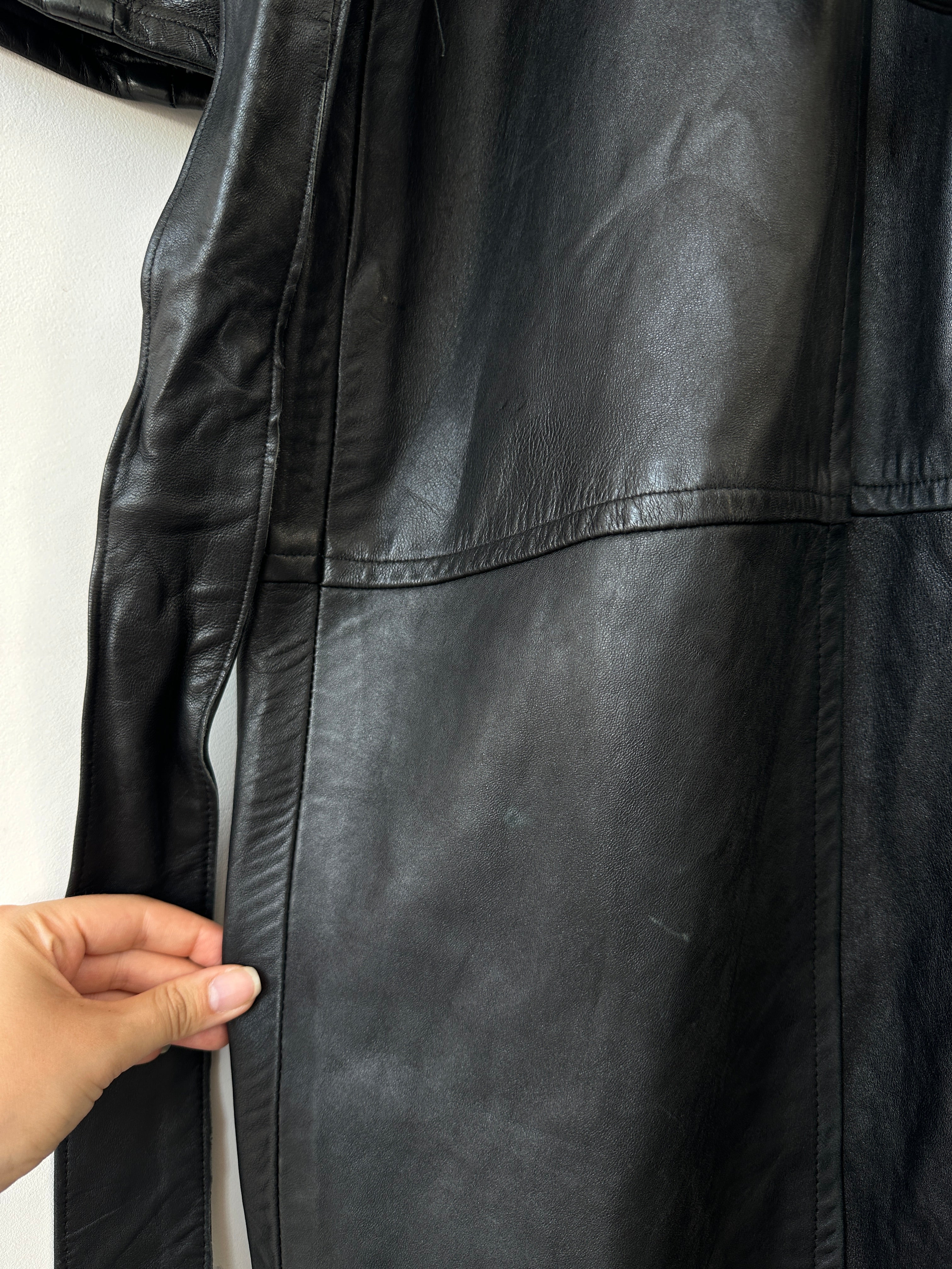 Vintage leather coat with belt, full-length jacket in size M, featuring classic design and smooth leather texture.
