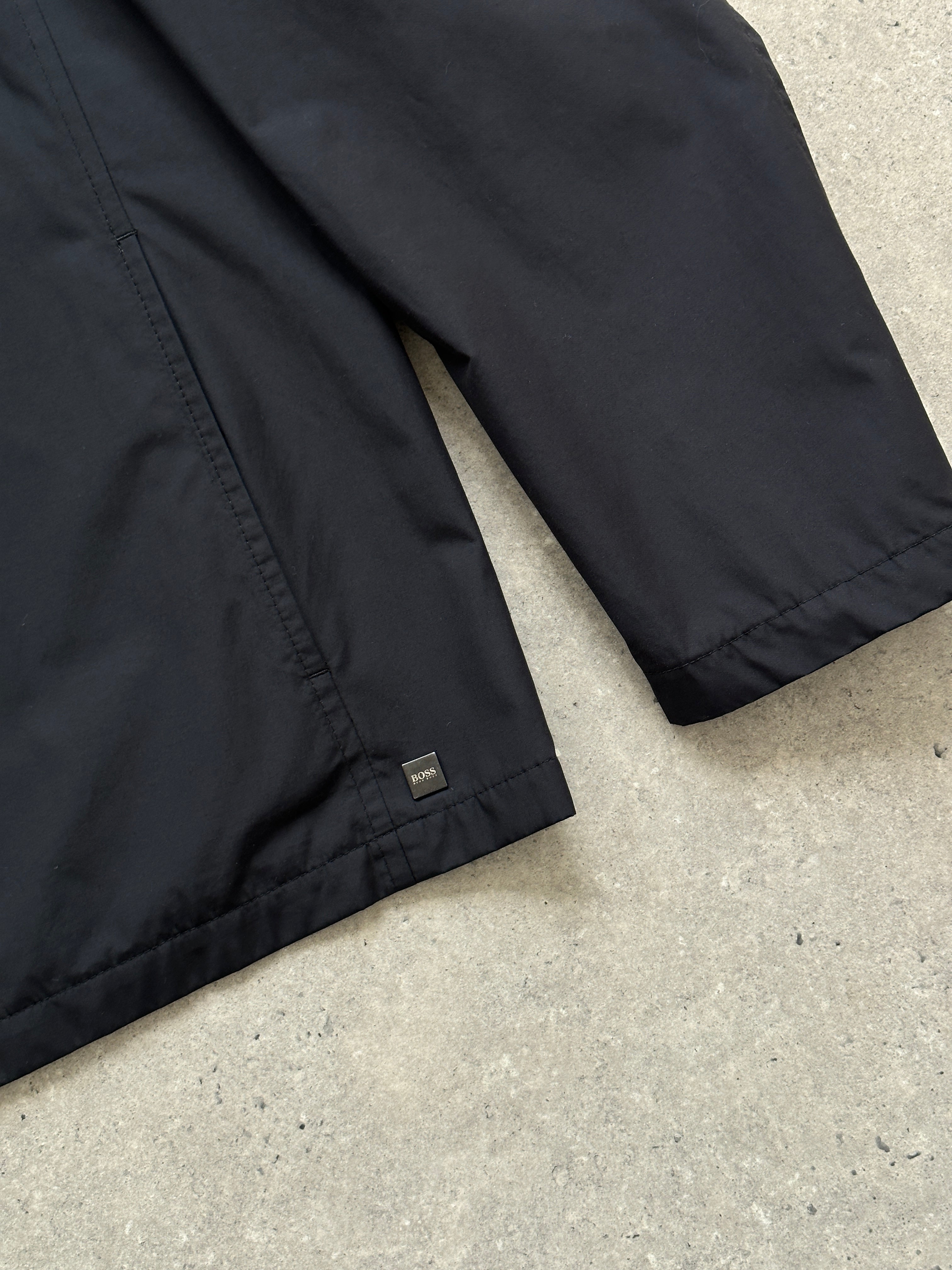 Hugo Boss minimal zip-up jacket in size L, featuring a sleek design with a front zipper and classic collar.