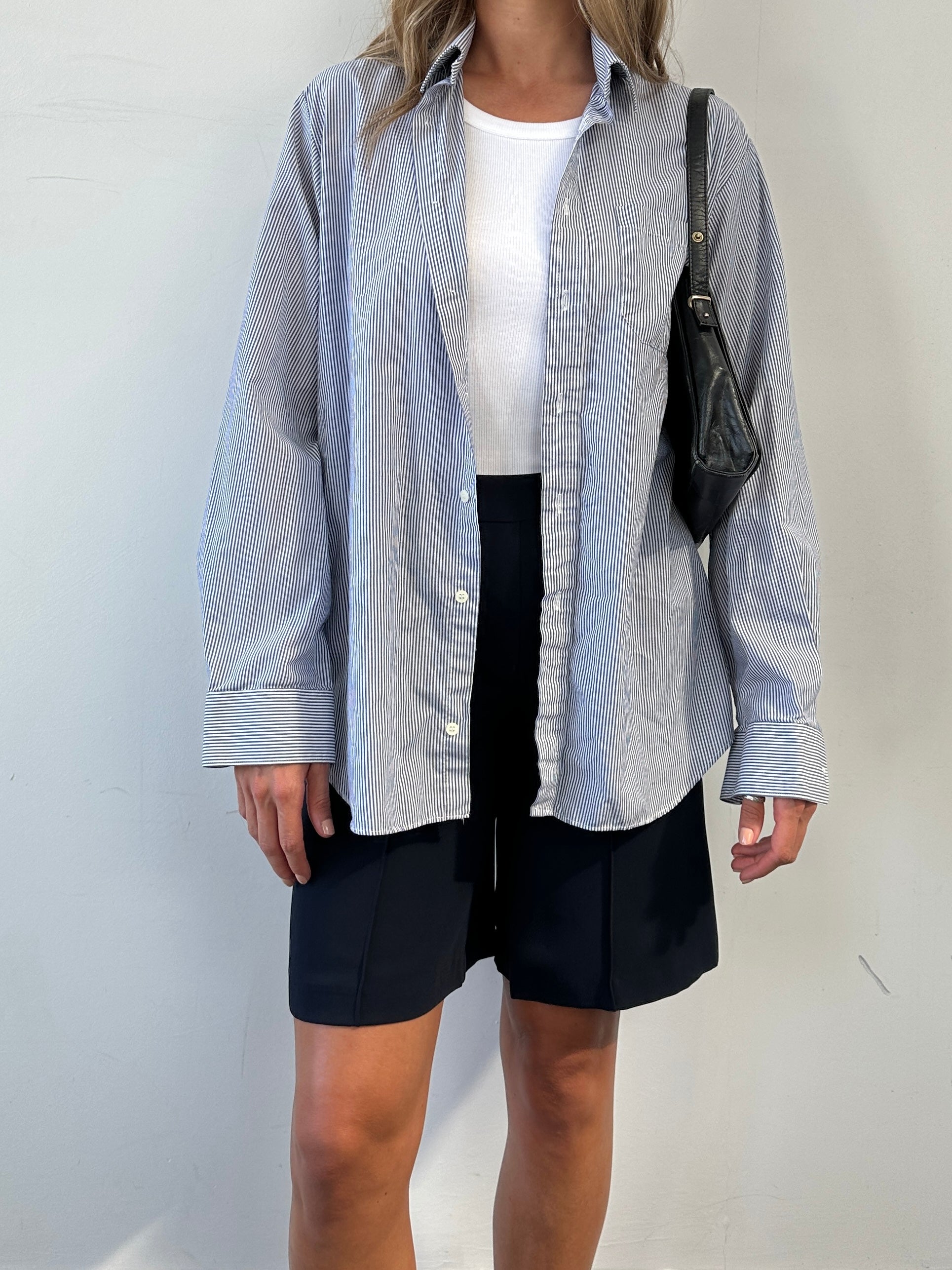 St Michael pinstripe shirt in size M/L, featuring a classic button-up design with light blue and white pinstripes.
