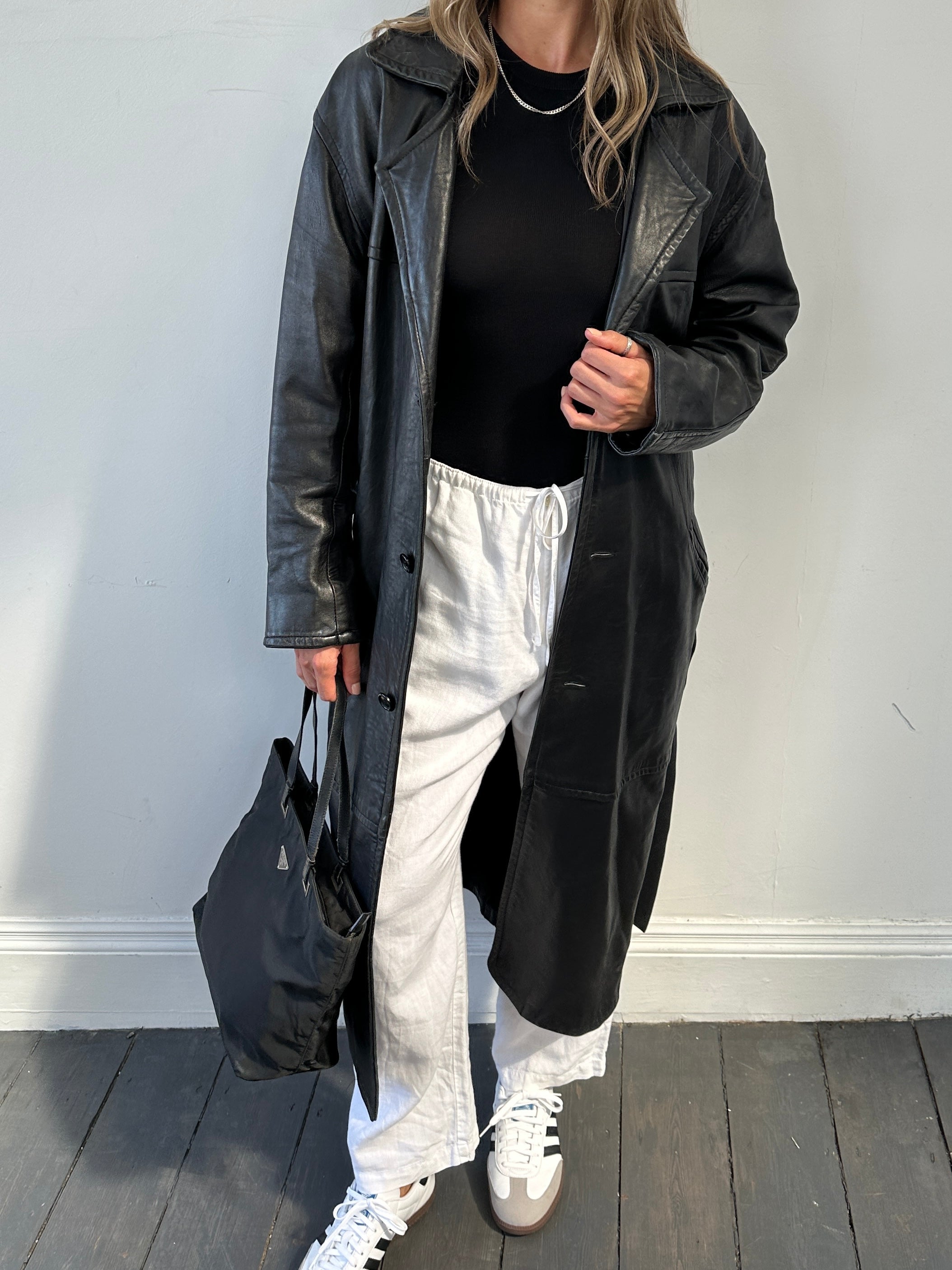 Vintage brand vintage leather coat with belt, floor-length jacket in size M, stylish and classic outerwear for cold weather.