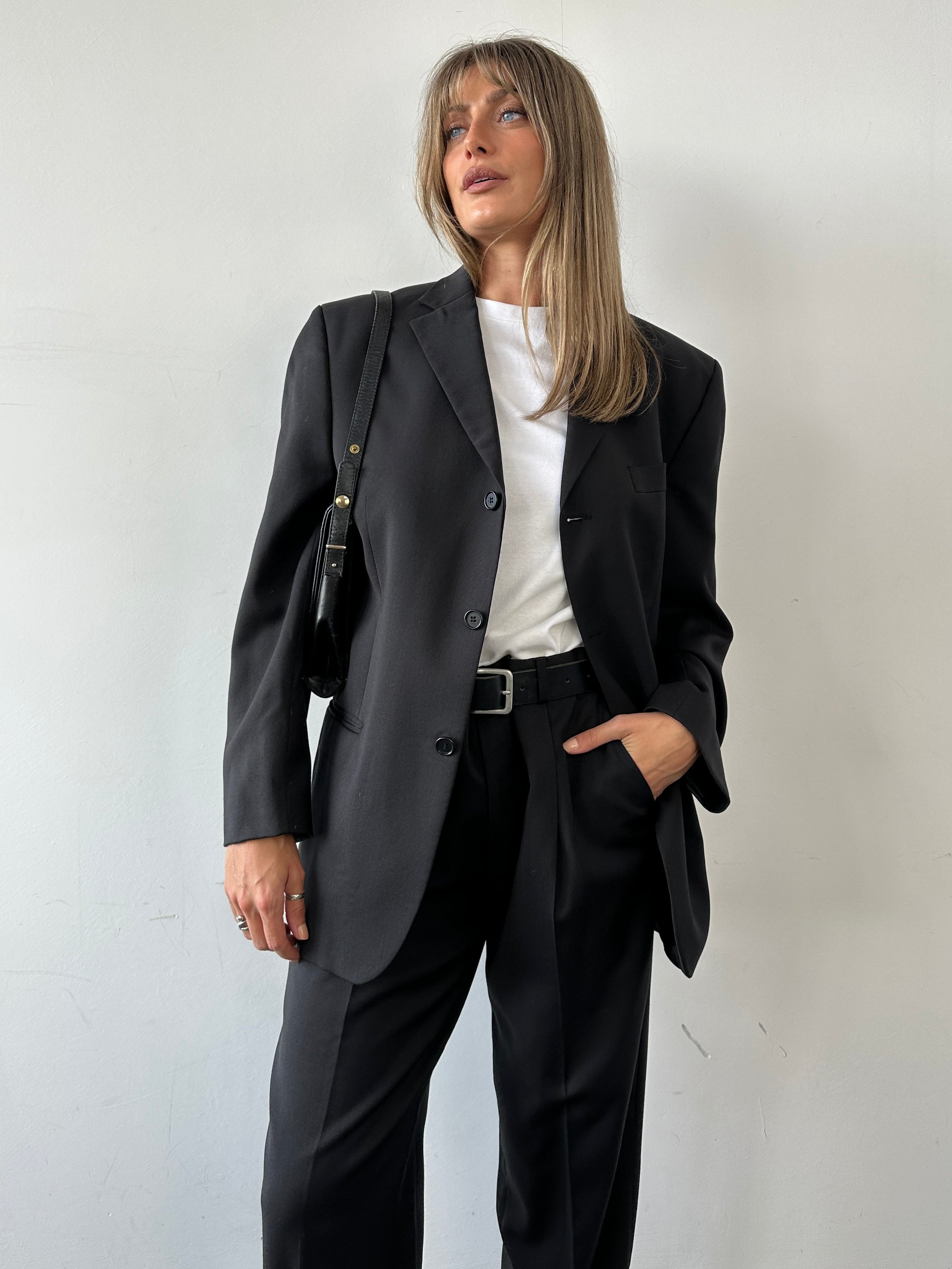 Pierre Cardin pure wool single-breasted suit jumpsuit in size 40R/W34, shown on a hanger with front view and tailored fit.