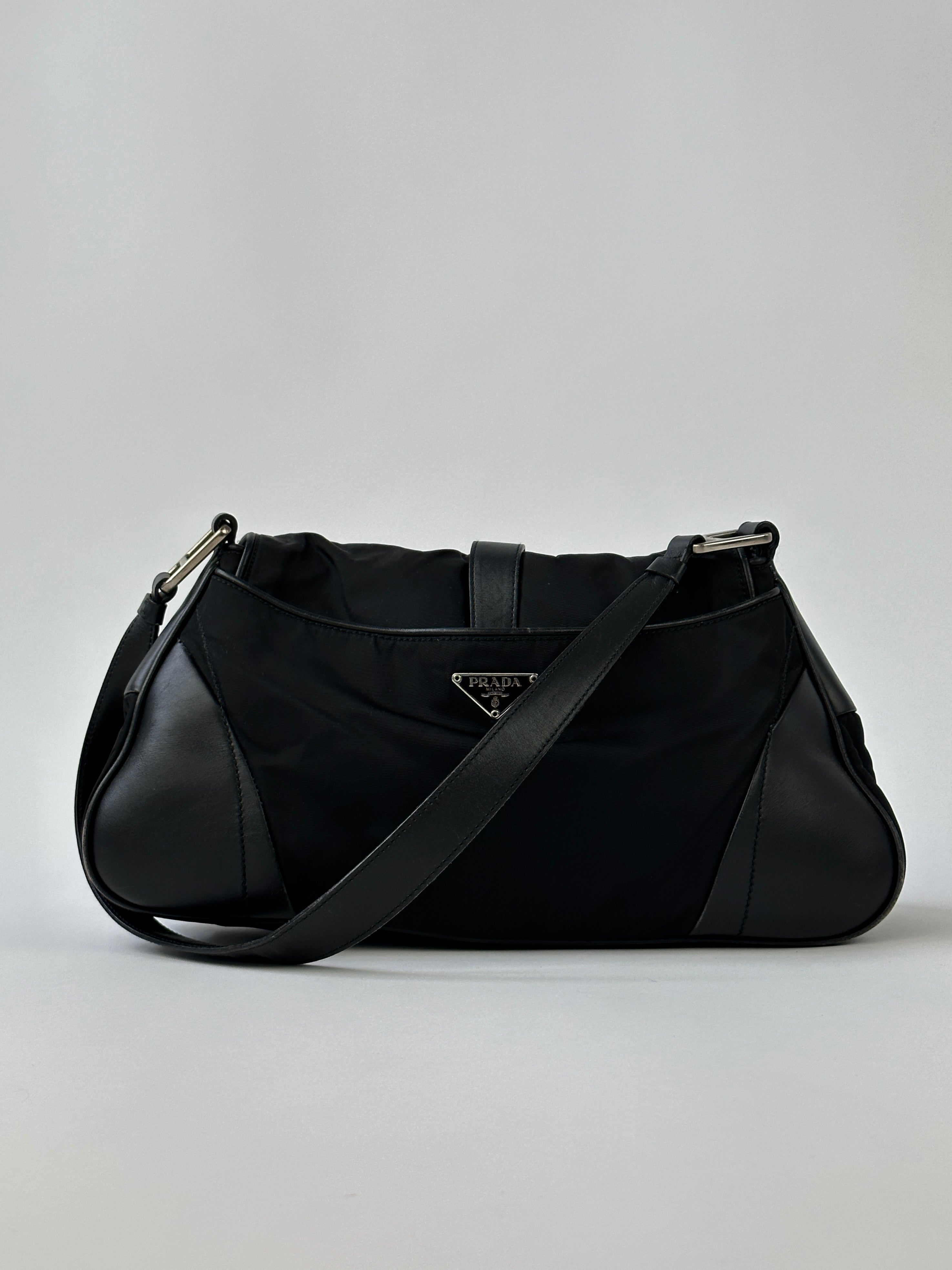 Prada 2000s Tessuto nylon double-sided shoulder bag with sleek design and adjustable strap, displayed on a neutral background.