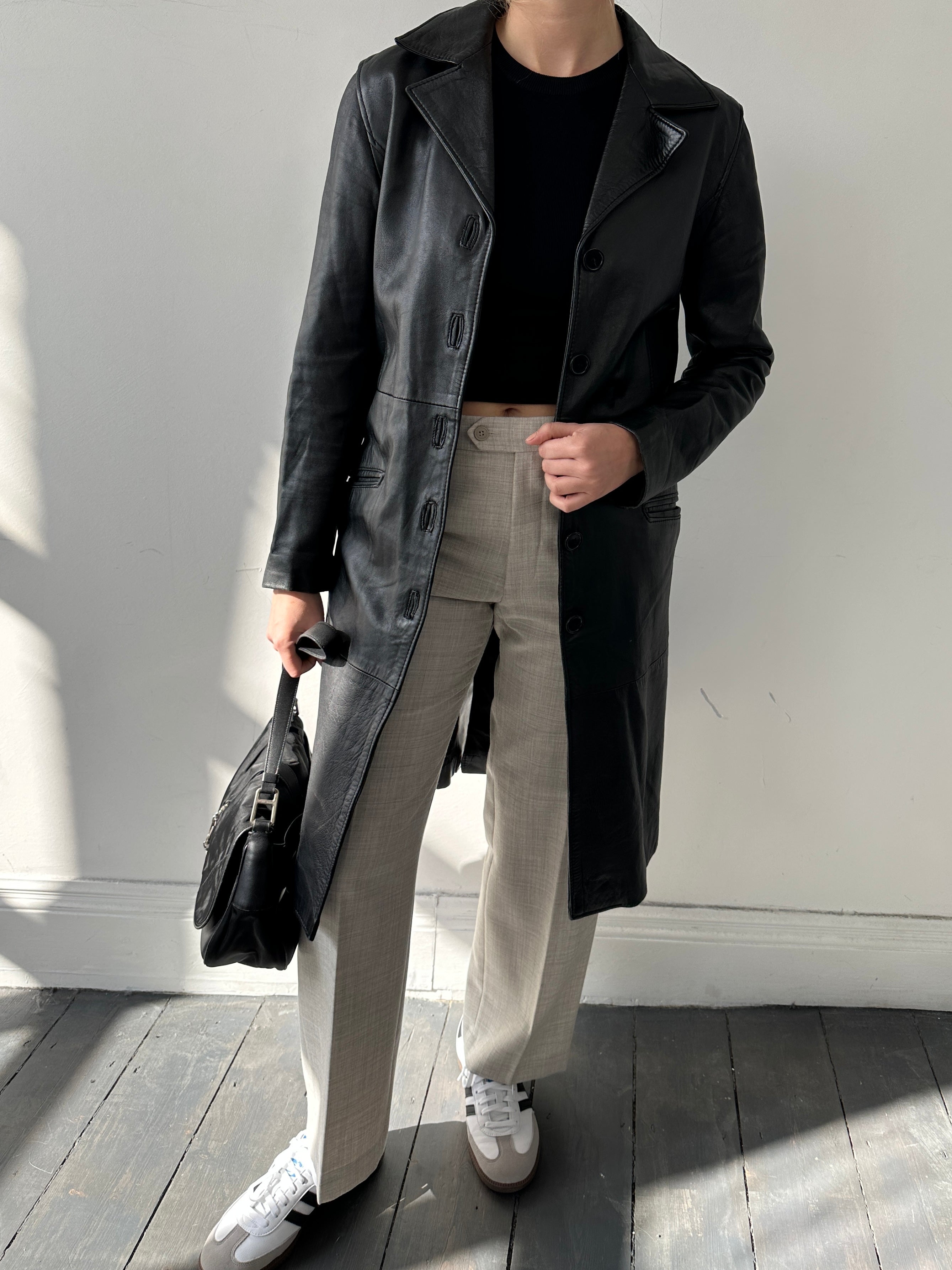 Italian Vintage Leather Jacket in XS, stylish retro design with classic leather texture, front zipper, and collar.