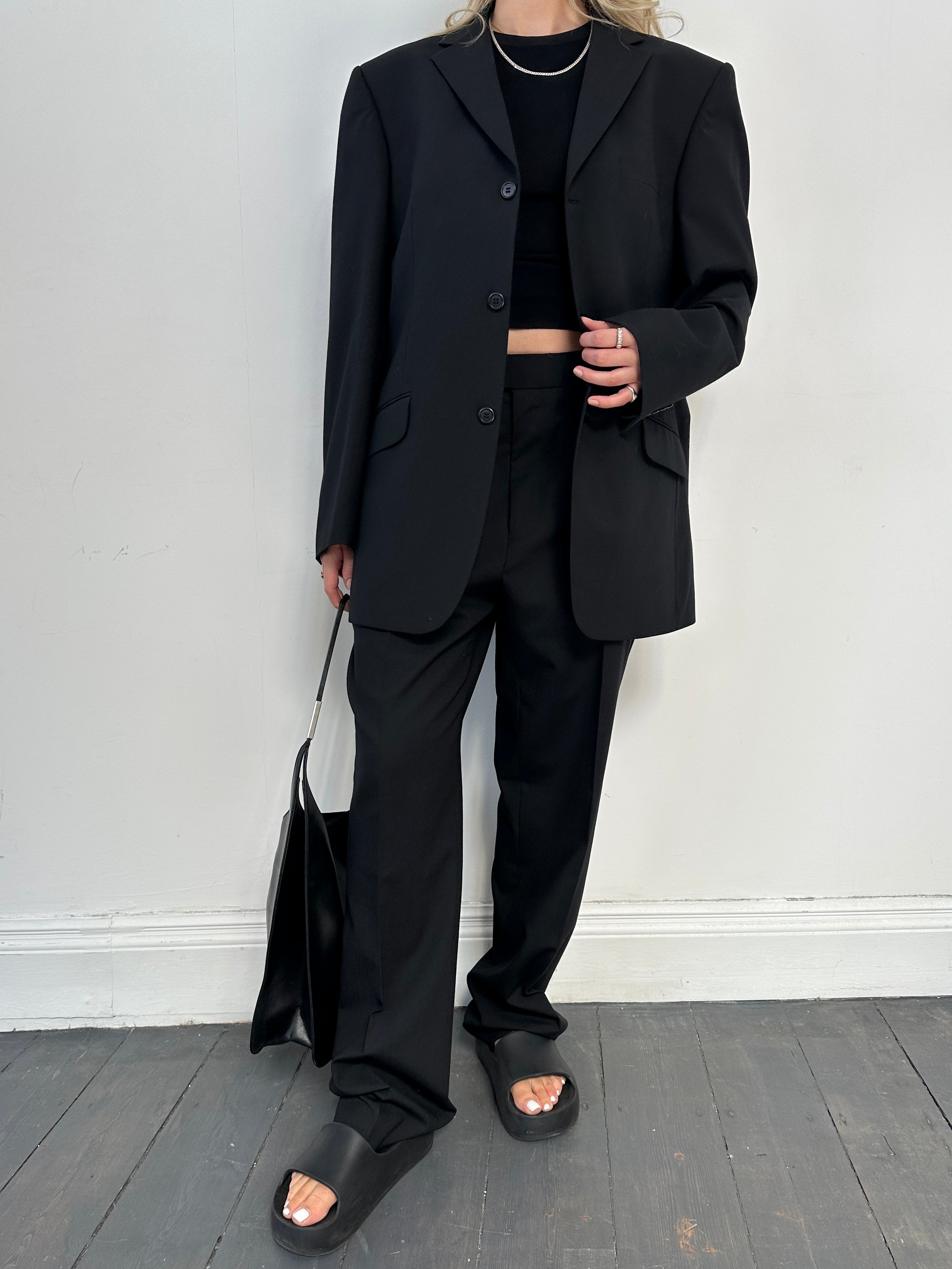 Vintage single-breasted wool blend suit jumpsuit in size 42R/W36, featuring classic tailored design and buttons.