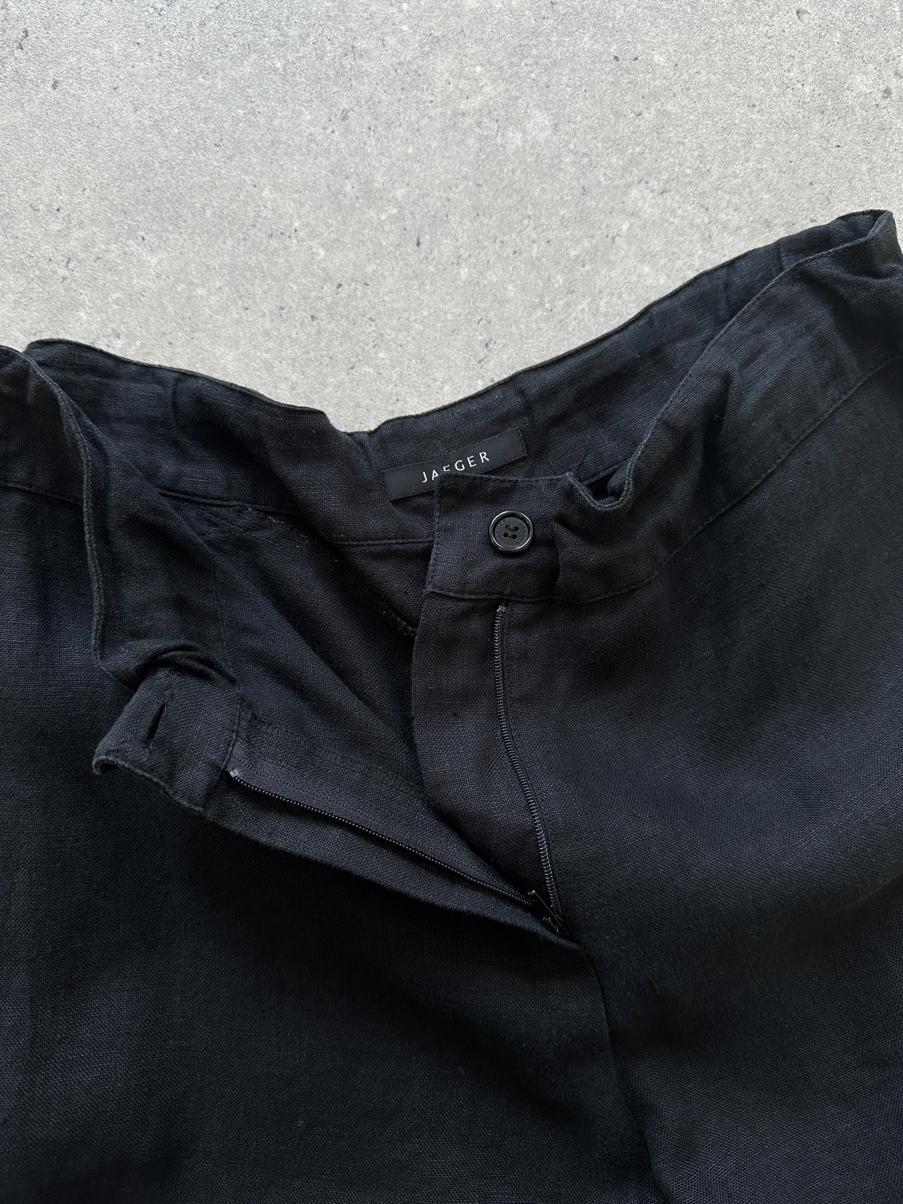 Jaeger linen wide-leg trousers with elasticated waistband in natural color, showing relaxed fit and lightweight fabric.