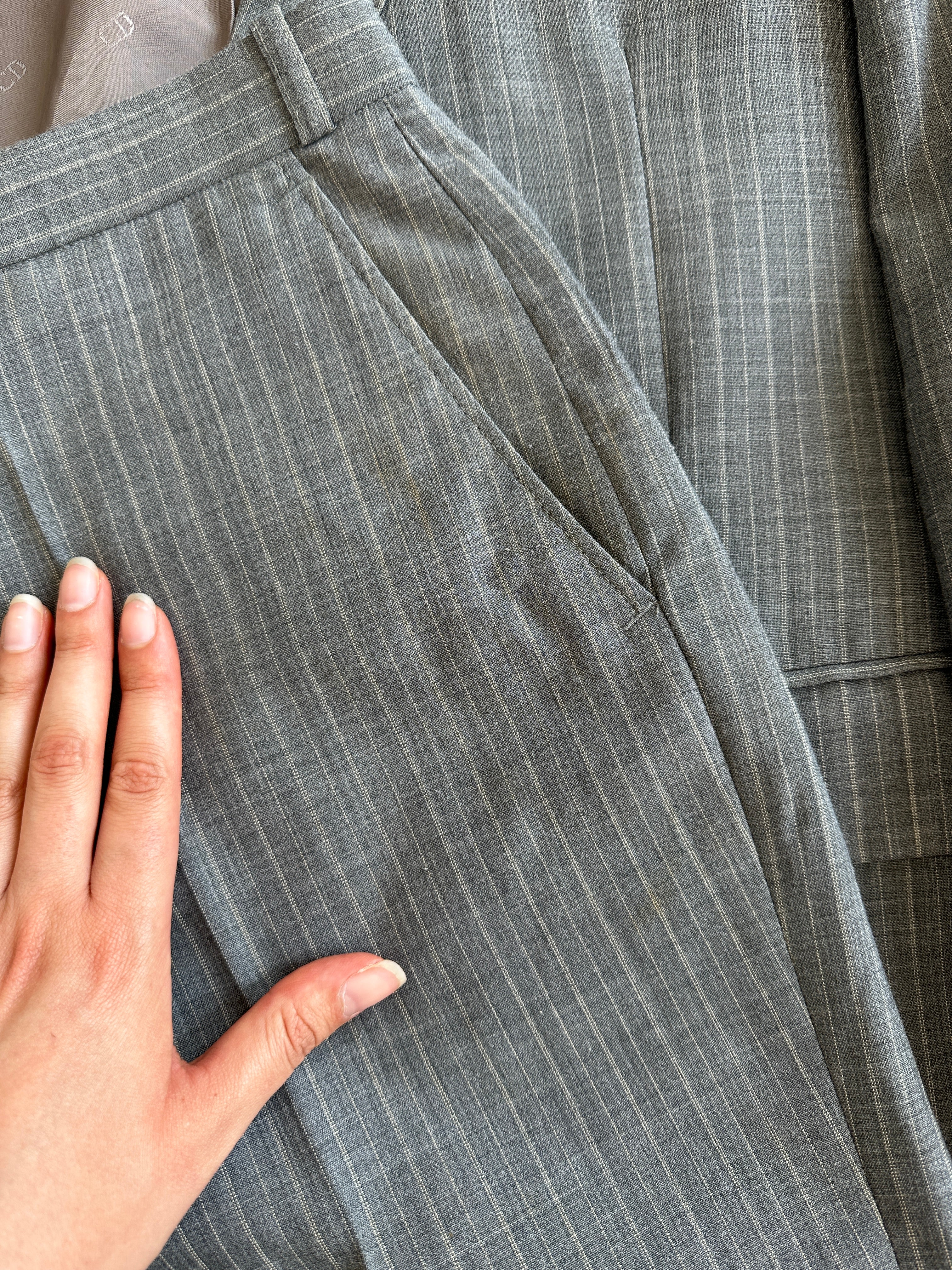 Christian Dior Monsieur pinstripe wool single-breasted suit jacket in size 40S/W34, tailored with classic lapels and button closure.
