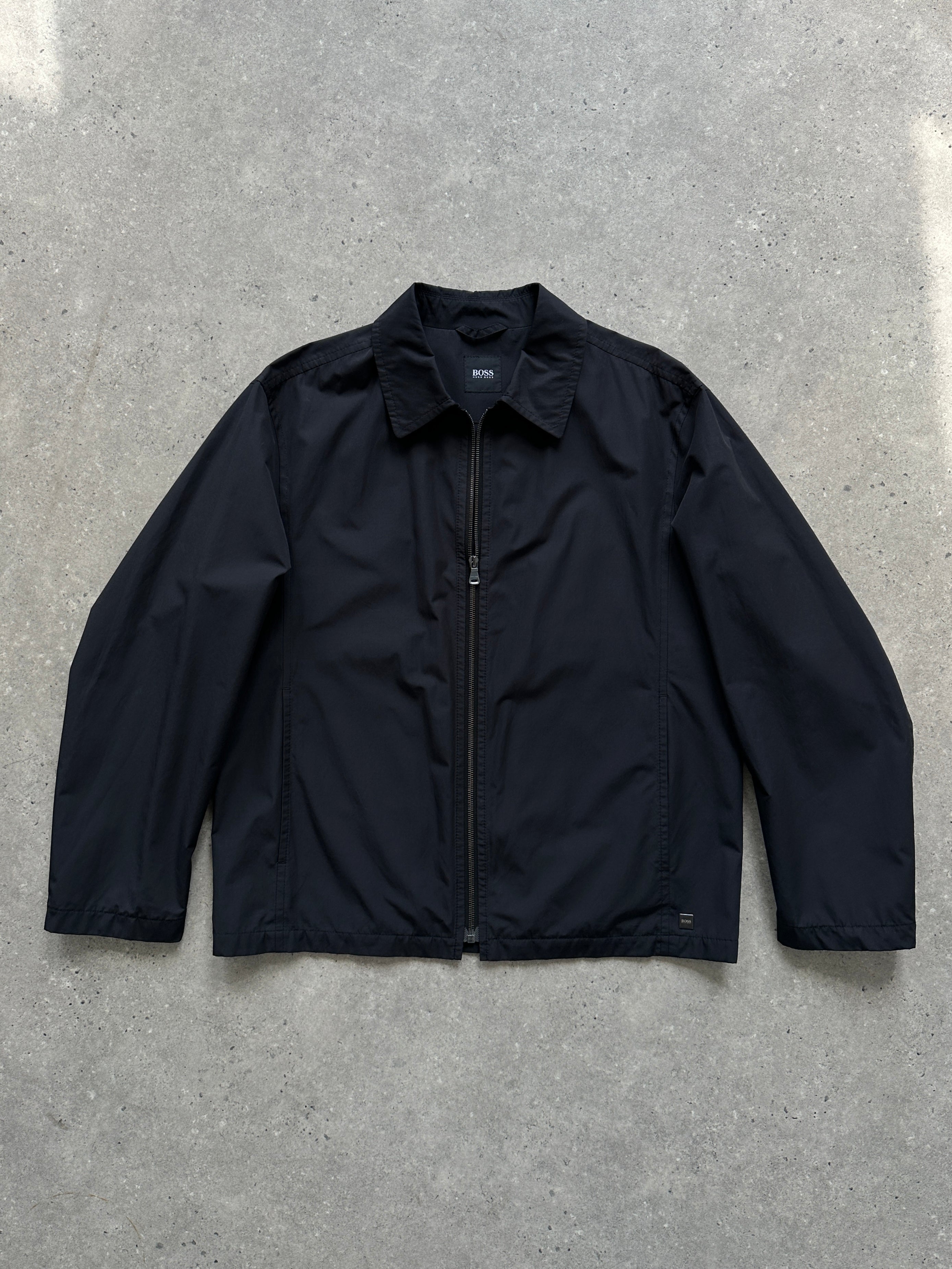 Hugo Boss minimal zip-up jacket in size L, black with a sleek design and front zipper, stylish casual outerwear.