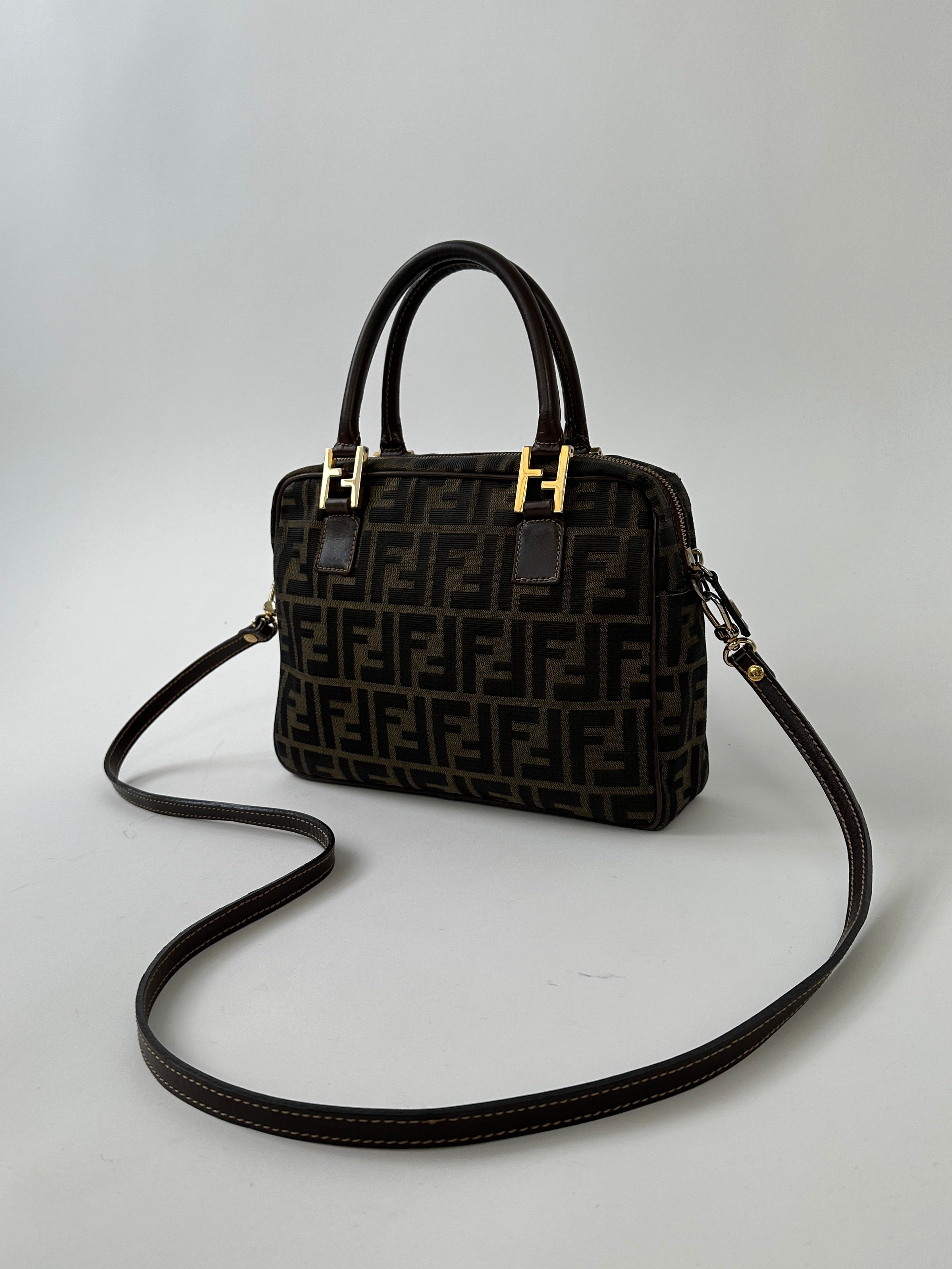 Fendi Zucca Monogram Crossbody Bag with adjustable strap and signature FF pattern, black leather accents, and gold hardware.