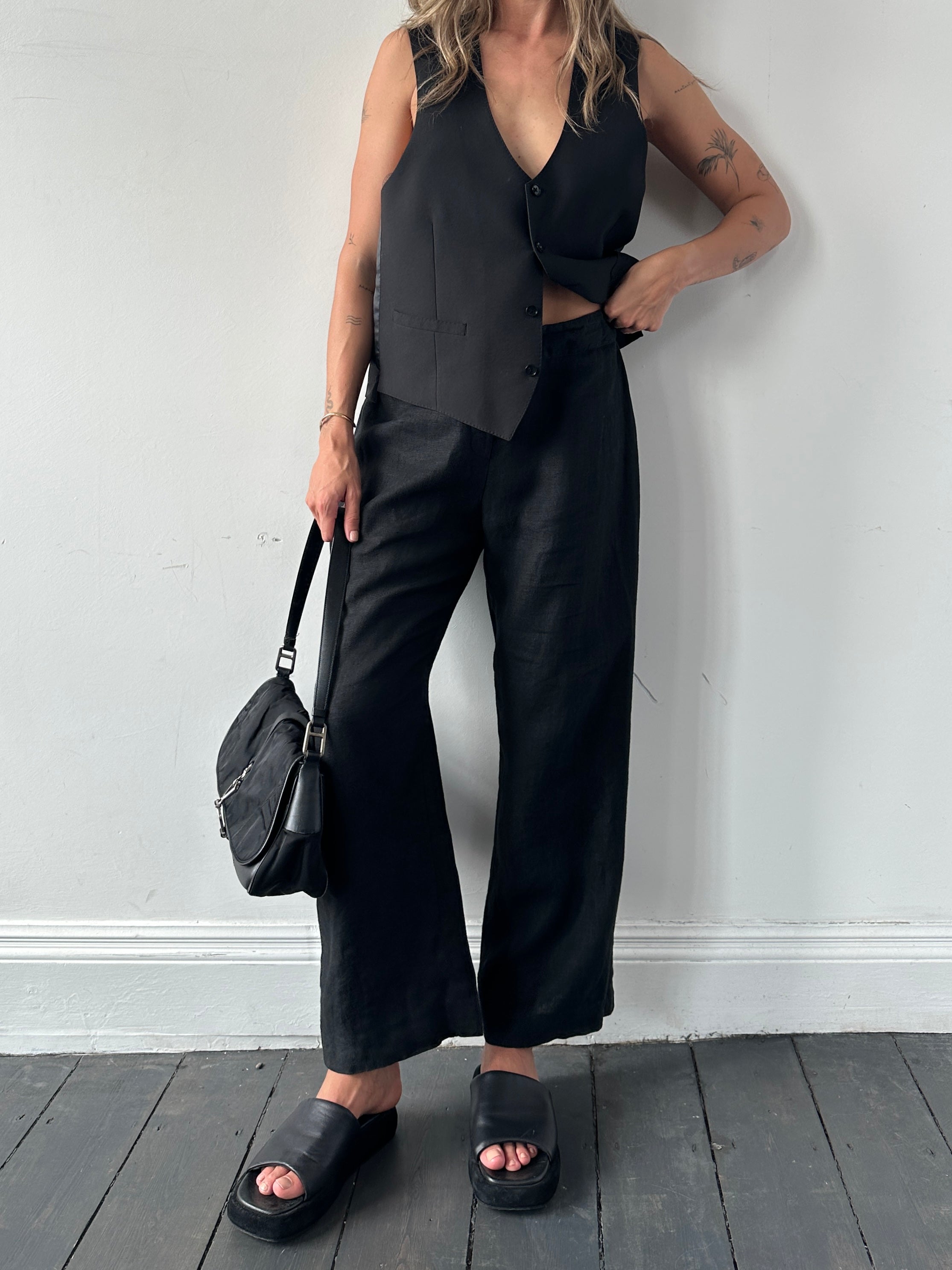 Light beige Jaeger linen wide leg trousers with elastic waistband and relaxed fit, shown on a model.