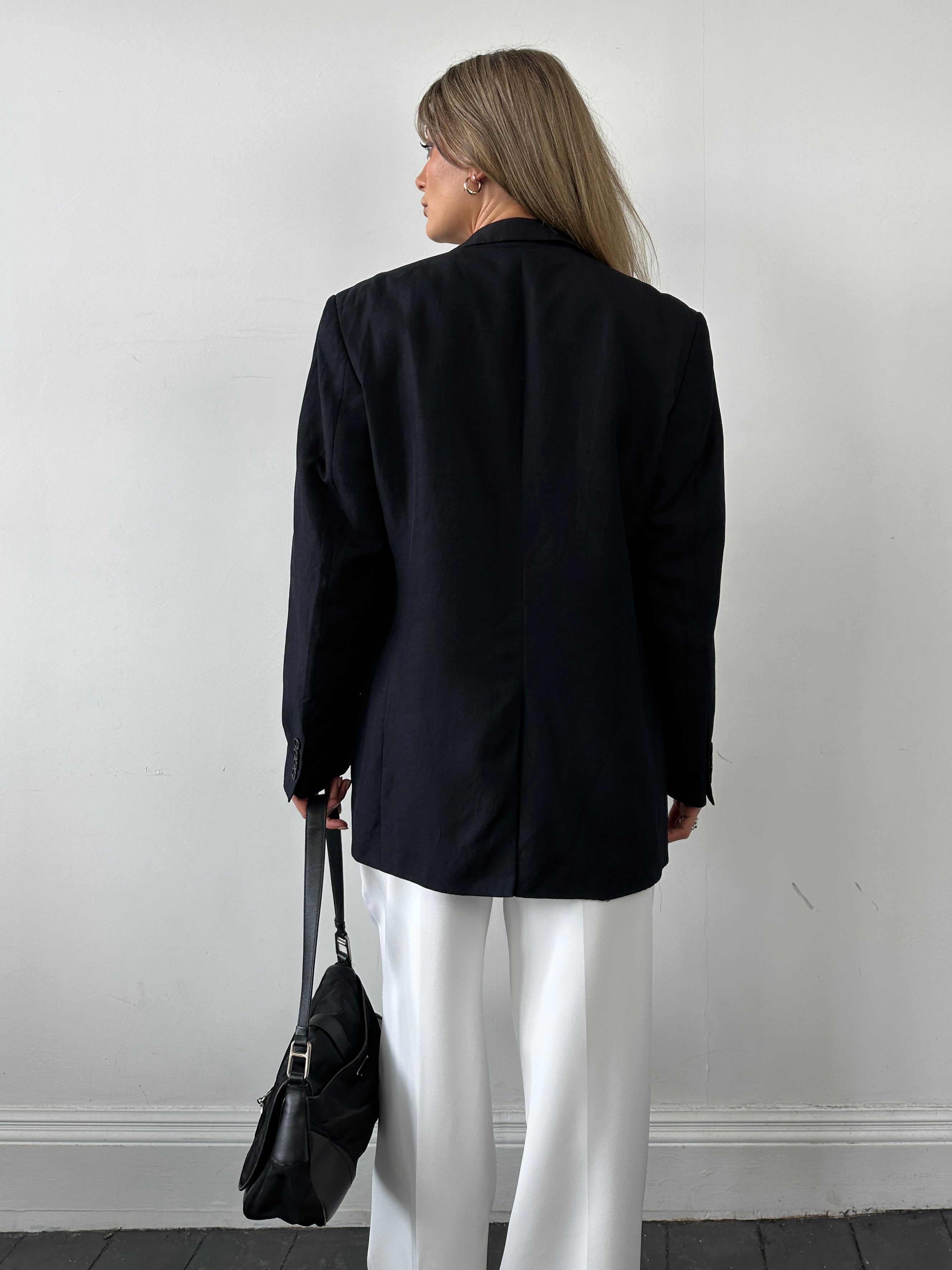 Jaeger silk linen single-breasted blazer in size 42R/M, shown on a hanger, featuring a classic tailored fit and neutral color.