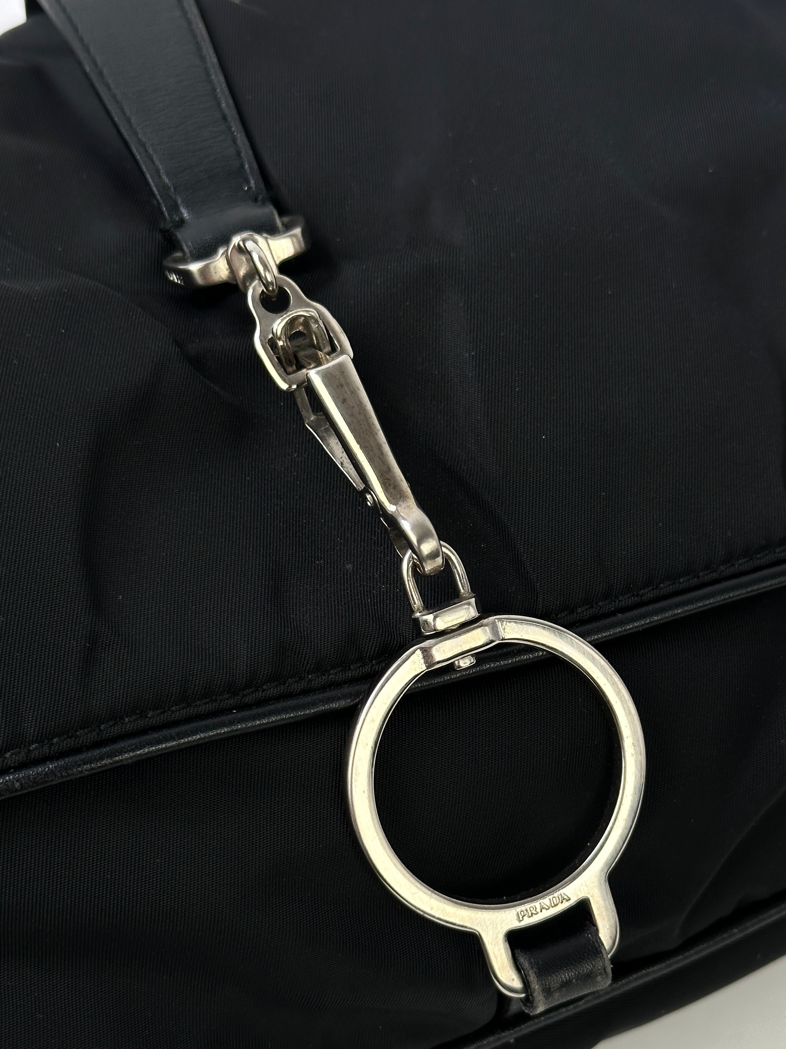 Prada 2000s Tessuto nylon double-sided shoulder bag with sleek design and adjustable shoulder strap.