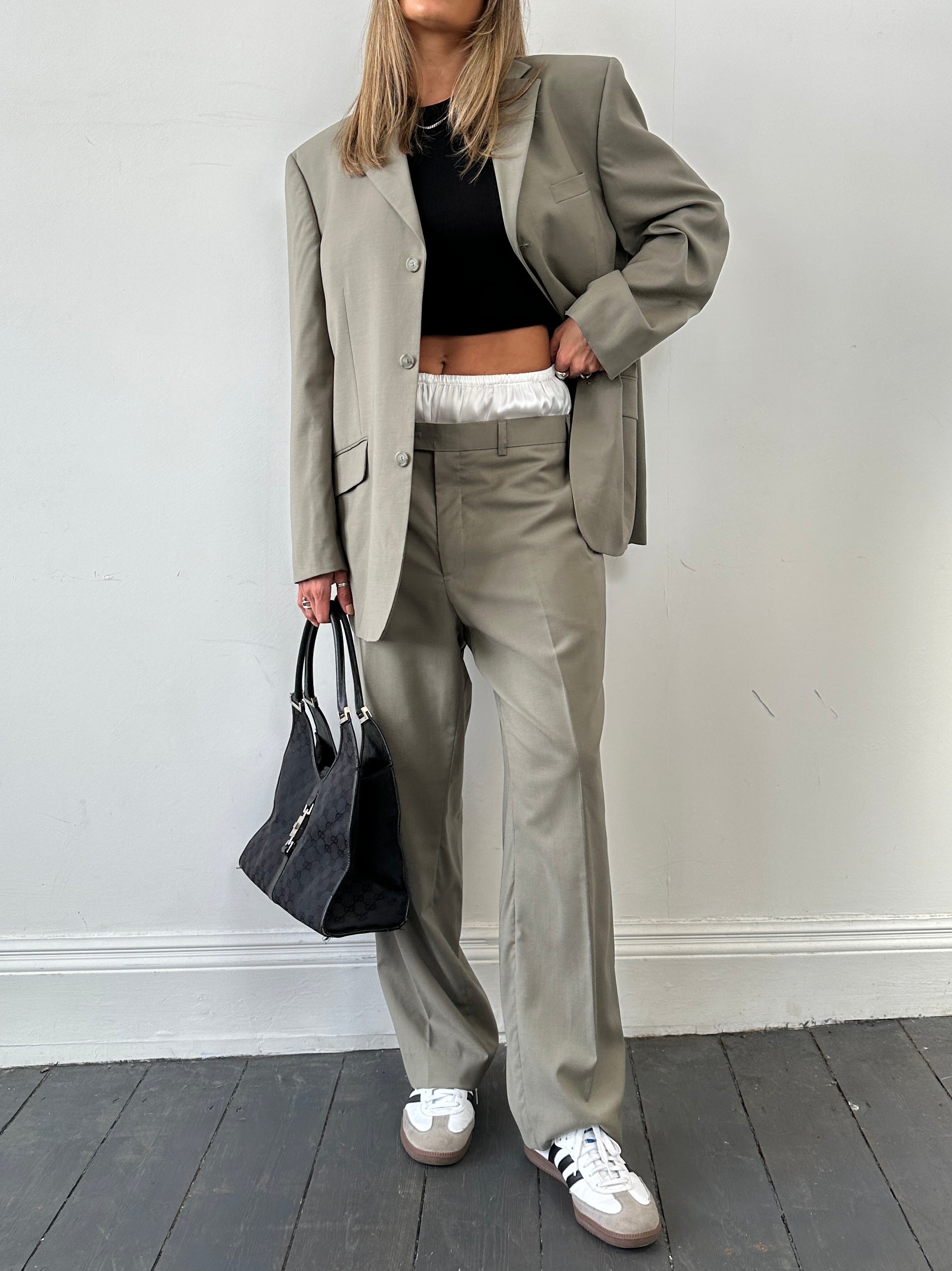 Vintage wool single-breasted suit jumpsuit in size 44R/W34, featuring classic tailored design and vintage fabric.