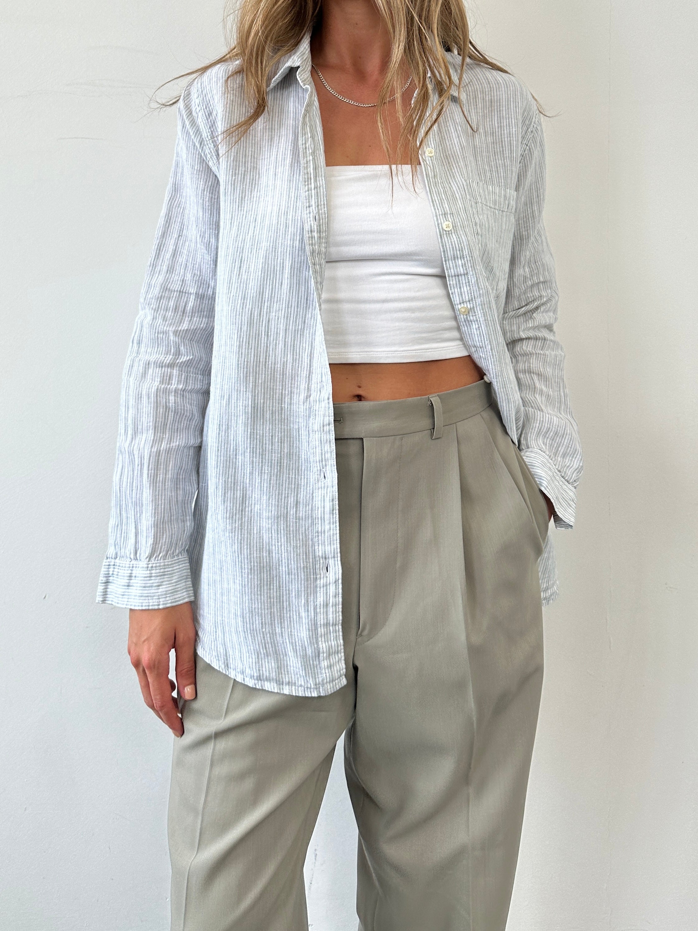 GAP pinstripe linen shirt in size M, featuring a classic collar and button-down front, lightweight breathable fabric.