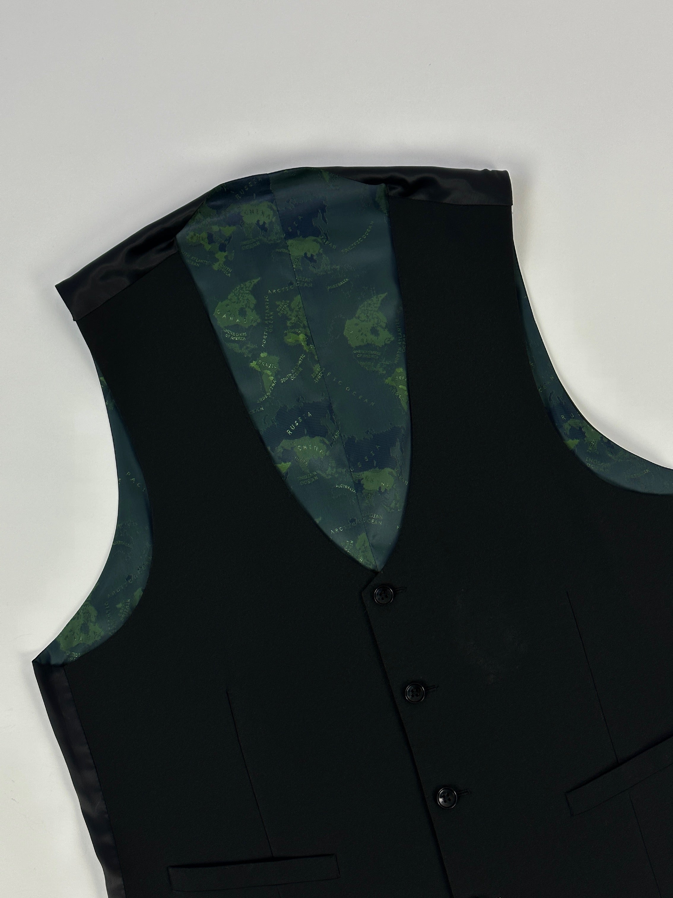 Vintage tailored single-breasted waistcoat, M/L size, in classic fabric, showing detailed lapels and button closures.