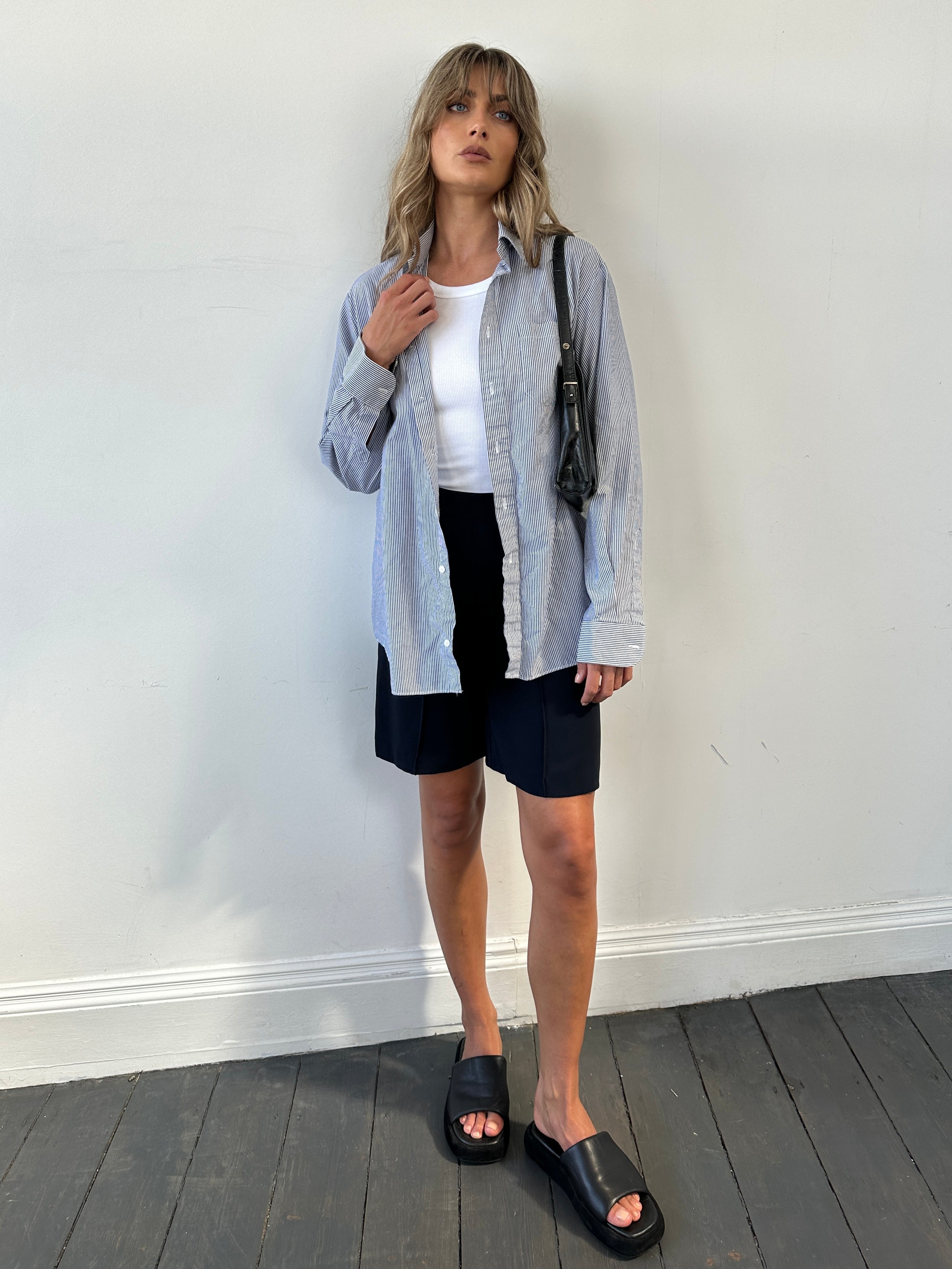 St Michael pinstripe shirt in M/L size, featuring a classic button-up design with blue and white pinstripes.