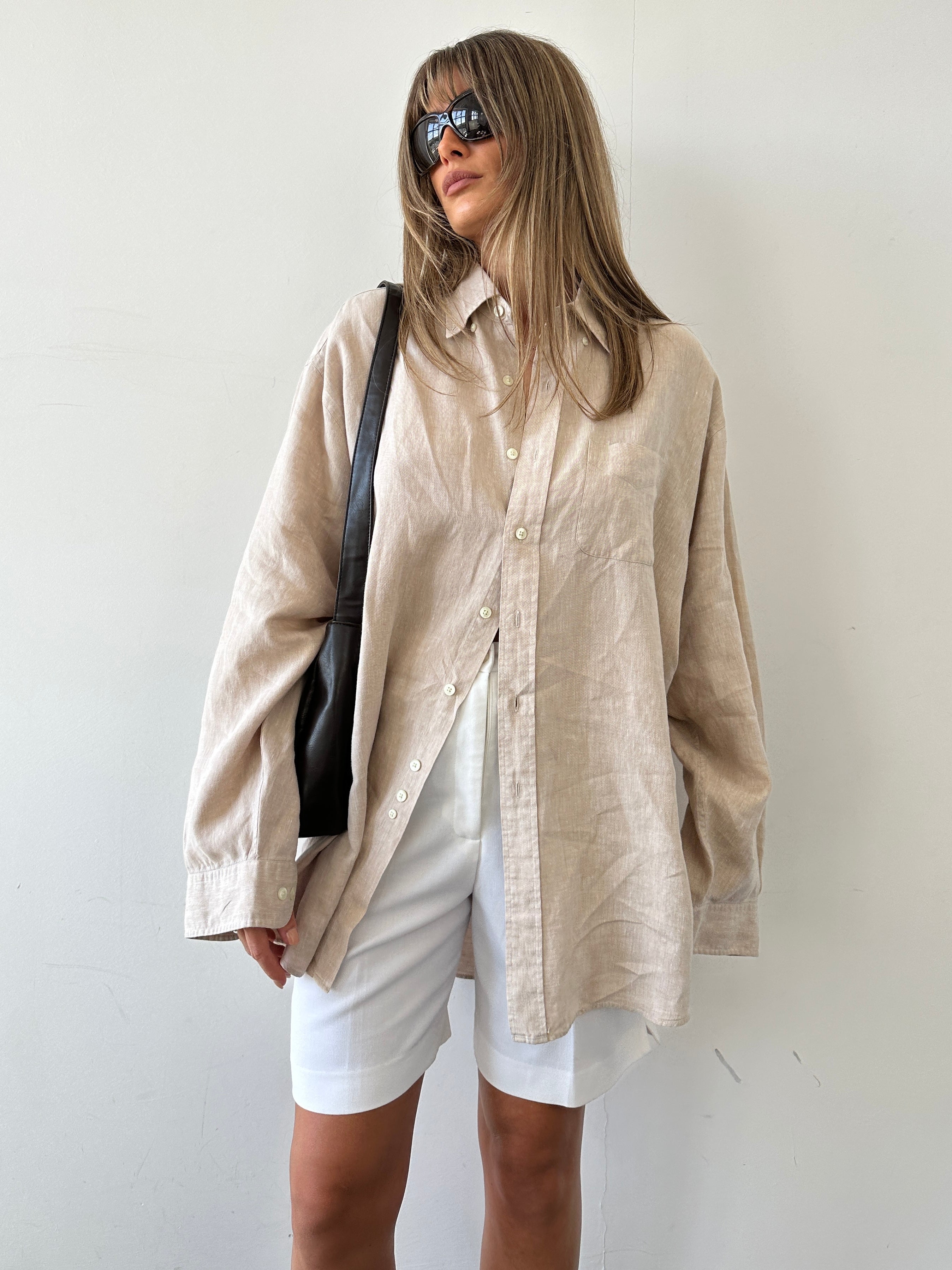 Brooks Brothers pure linen shirt in XL/XXL, light-colored, with a classic collar and button-down front, displayed on a hanger.