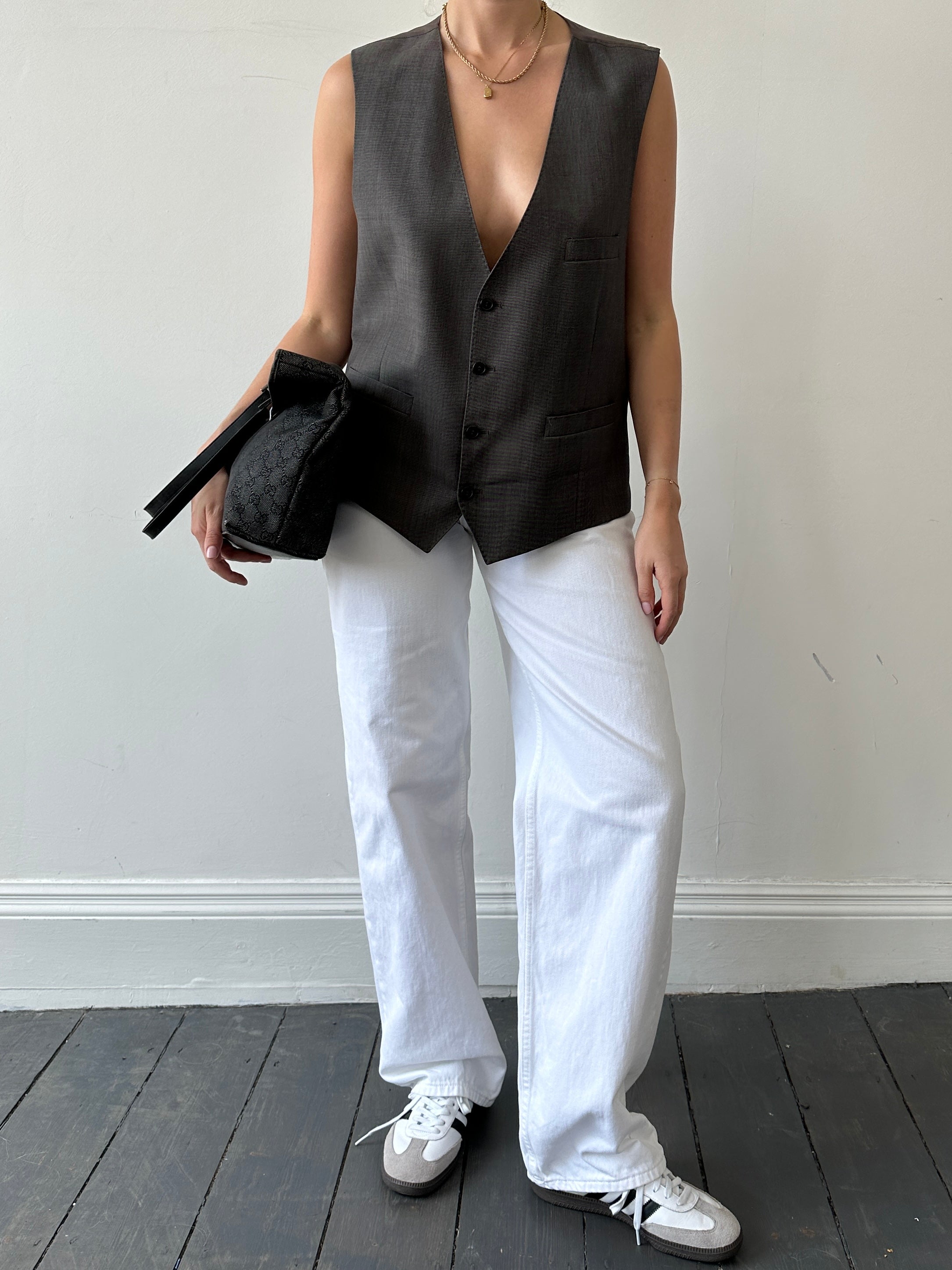 Vintage single-breasted wool blazer from a two-piece suit, size 44 XL, featuring classic tailored design and dark navy color.
