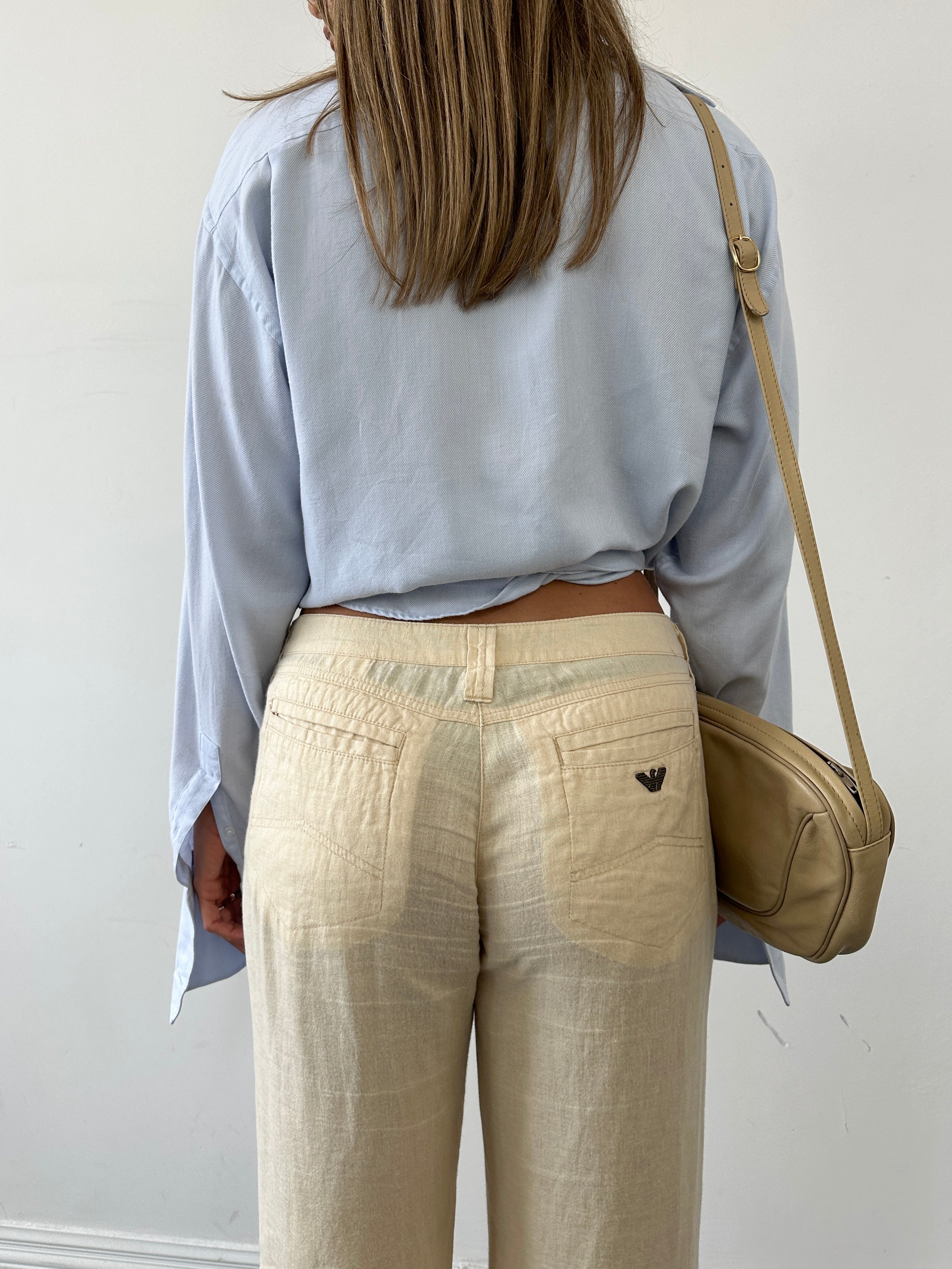 Armani Jeans low rise pure linen flared trousers in size W29, lightweight and stylish, shown on a neutral background.